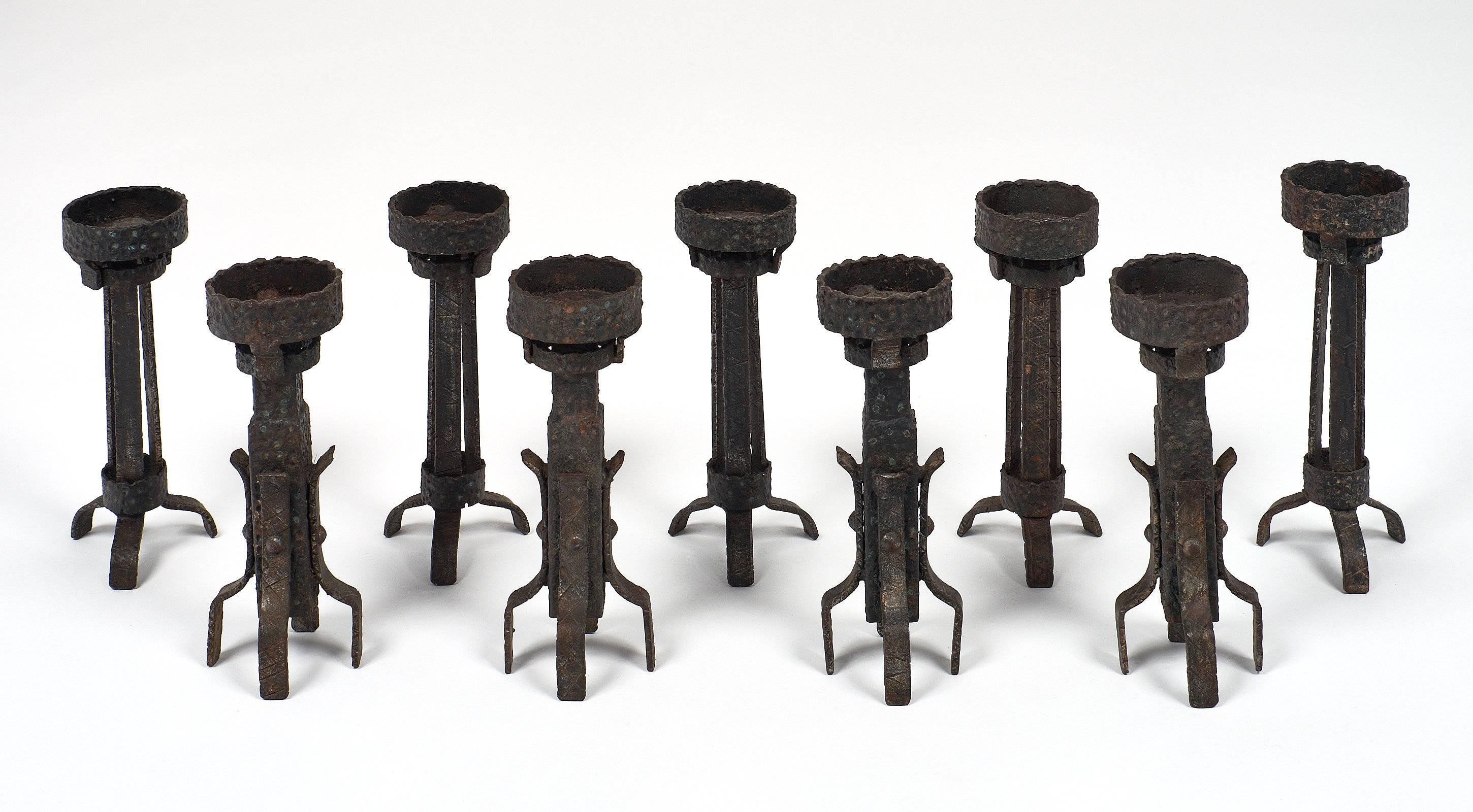 A rare set of forged and hand-hammered iron candlesticks from a private chapel in the region of Barcelona. Each of them uniquely crafted with specific details. We loved the originality of the collection! As they are handmade, each has unique