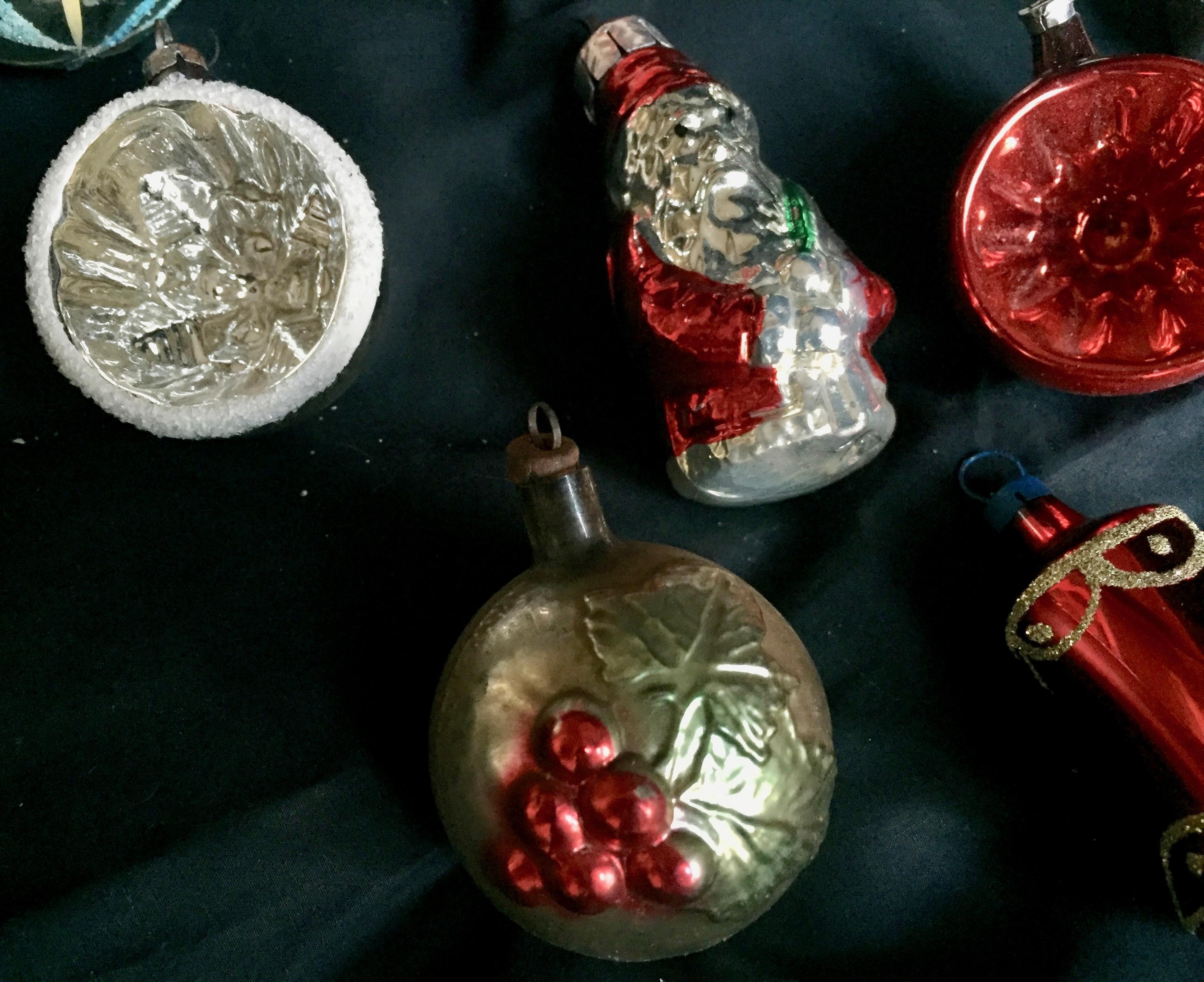 Nine vintage Mid-Century Modern German blown mercury glass Christmas tree ornaments. Fantastic reflections in silver and red
Measurement listed is for the santa.
   