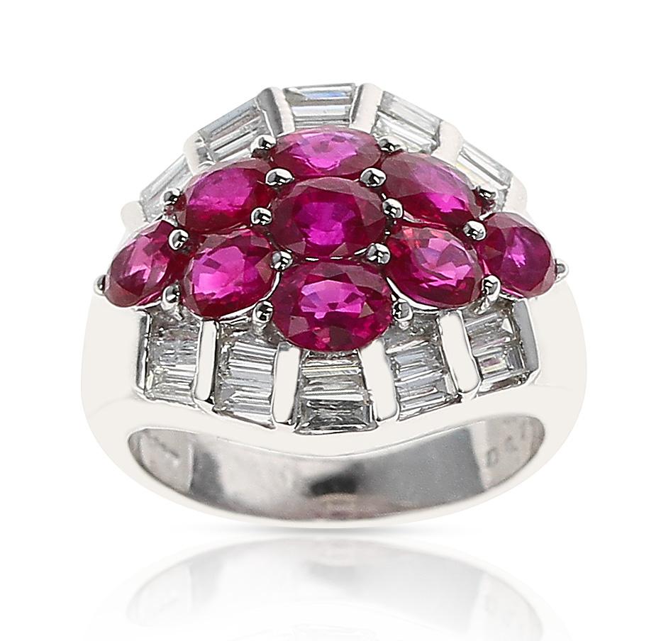 A Nine Oval Ruby and Diamond Baguette Estate Ring made in Platinum. 
The total weight of the ruby is 3.23 carats. The total diamond weight is 0.74 carats. The total weight of the ring is 10.70 grams. Ring Size US 5.75.