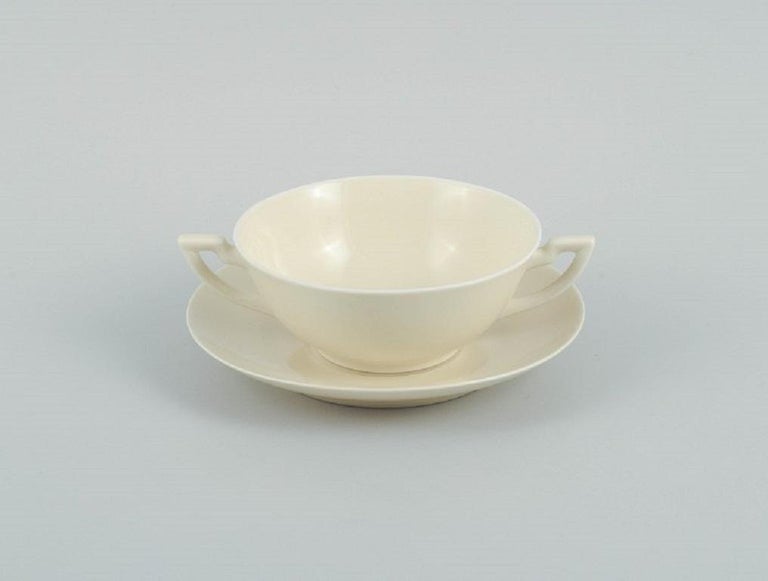 Nine Pairs of Royal Copenhagen CreamColoured Bouillon Cups with