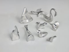 Nine Piece Collection of Hoselton Canada Polished Stylized Figures