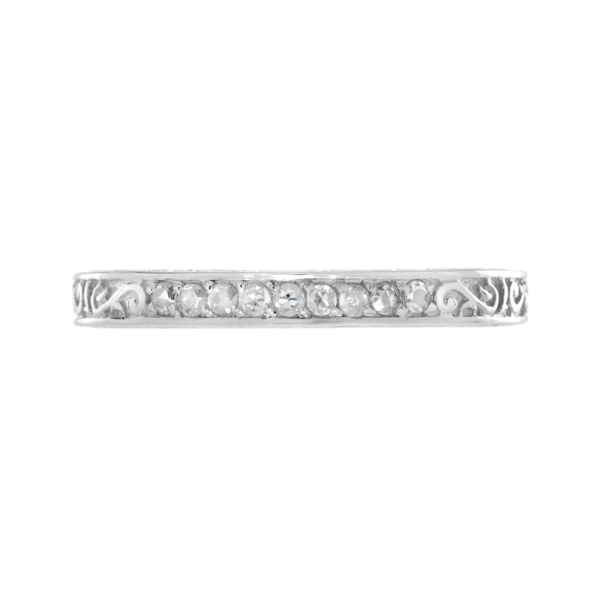 This is a lovely Victorian era design band ring. It is set with nine rose cut diamond, estimated total weight is .14 carat H color, SI clarity overall. Beautifully made yellow gold band with engraved design. 14K White Gold.
Ring Information
Style: