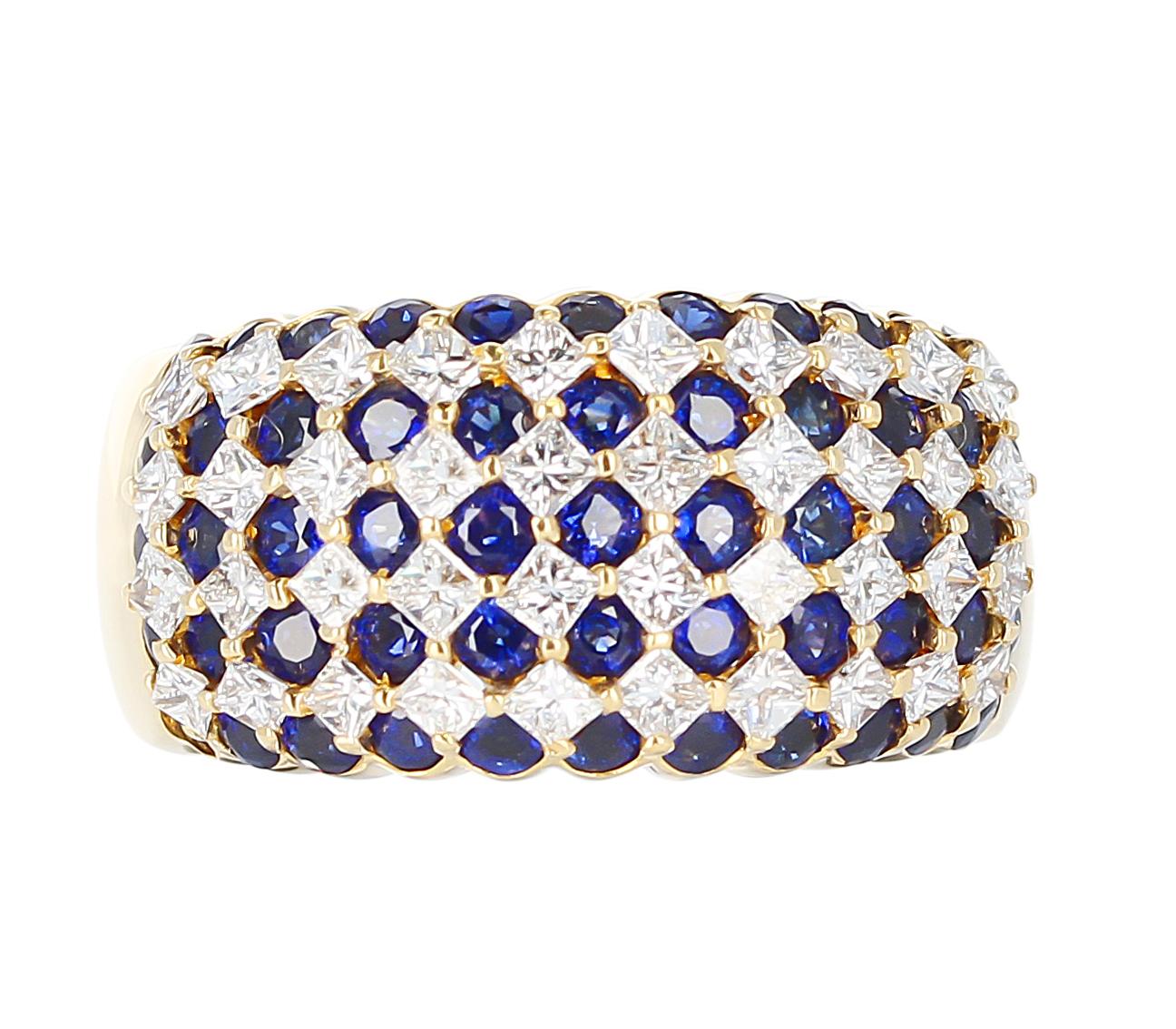 A nine row sapphire and diamond cocktail ring in 18 Karat Yellow Gold. The sapphires weigh 3.72 carats, and the diamonds weigh 1.67 carats. The total weight is 16.47 grams, Ring Size US 8.25.  