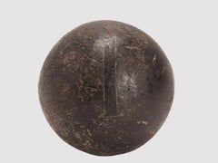 Nine spheres: weighting only twice and try to find the heaviest one, France 1900
