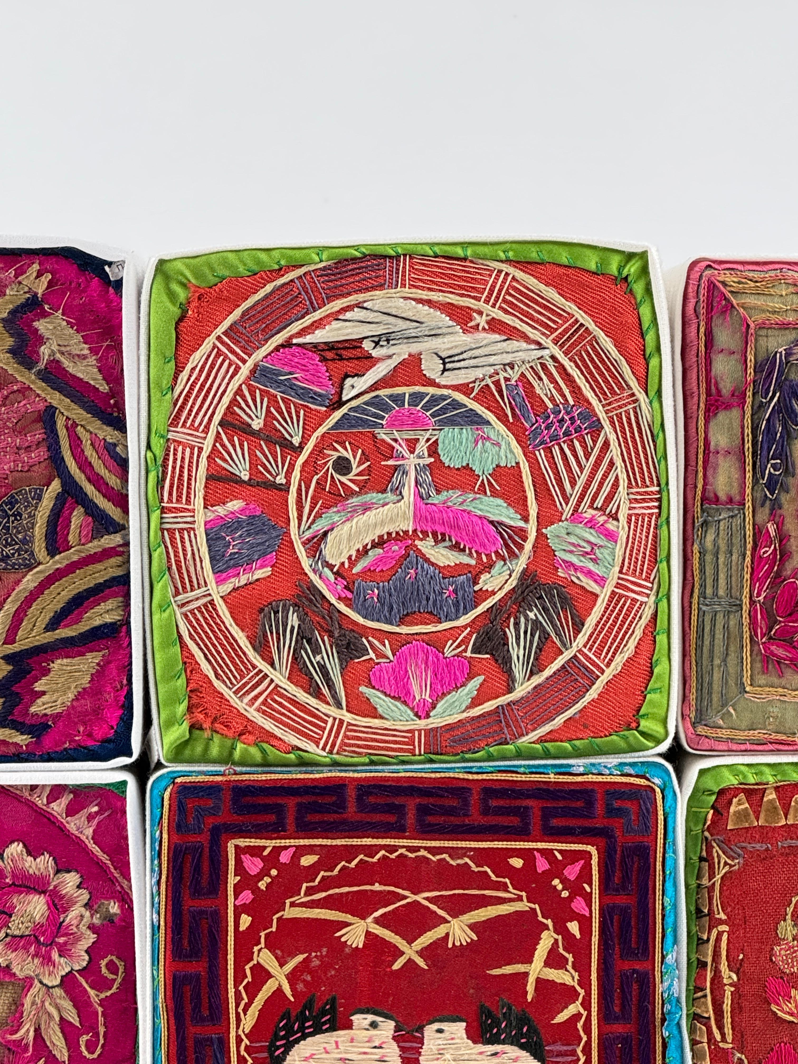 These traditional Korean embroidered pillows, often included in a bride's dowry during the modern era, symbolize auspicious blessings for a harmonious and prosperous married life. Featuring motifs such as cranes and pine trees for longevity, paired