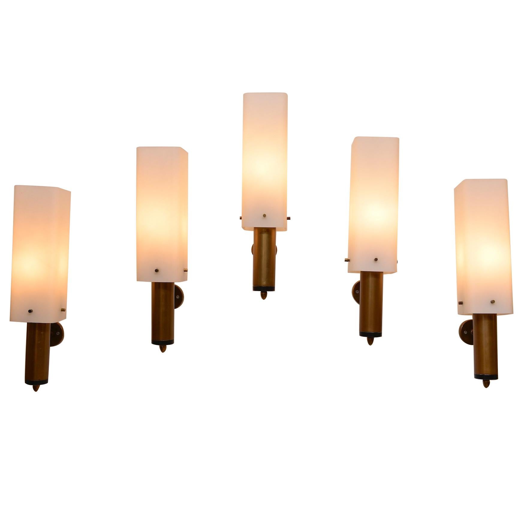 Very chic Stilnovo wall lights. Opaline glass with brass details. 

Increasingly hard to find original glass and brass wall lights by Stilnovo, Milano, Italy, circa 1950.

Re wired for Europe and US.