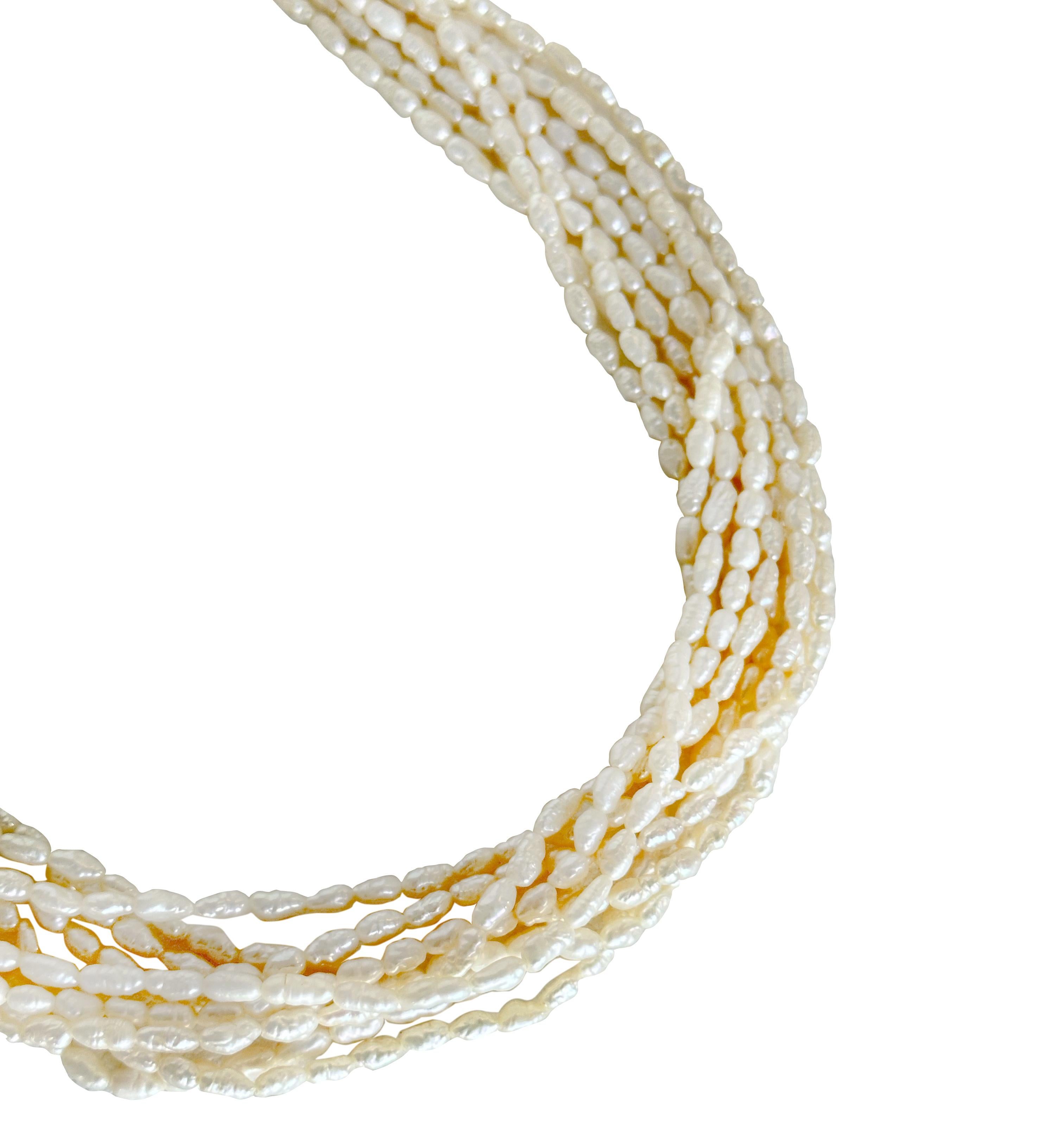 Elegant nine strands of freshwater pearls with a gold clasp, this necklace is perfect for elevating any outfit. Crafted in a classic French baroque style, each pearl is intertwined to create a beautiful and intricate design. 

Measuring 18.5 inches