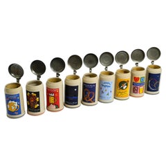 Used Nine unused Munich Oktoberfest beer Pitchers with tin lids from 2001-2009