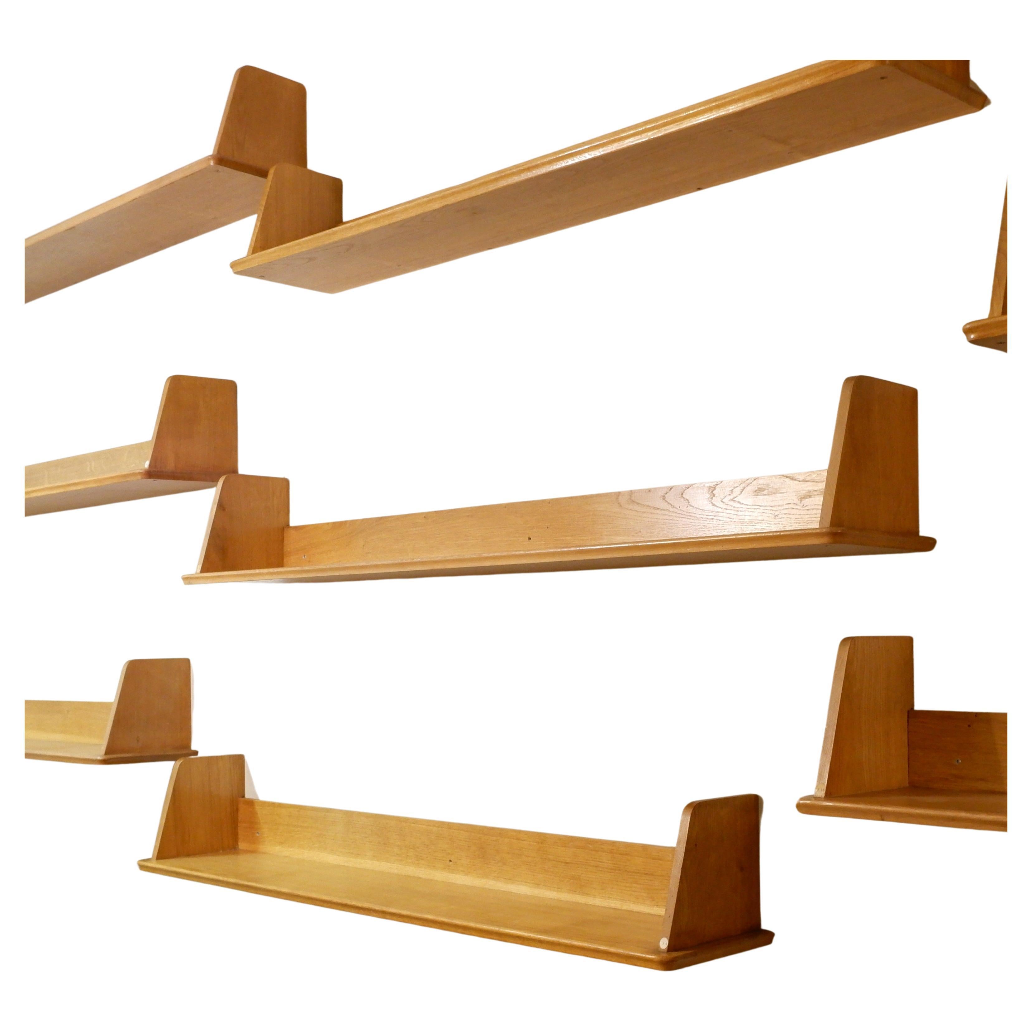Nine wooden wall shelves
