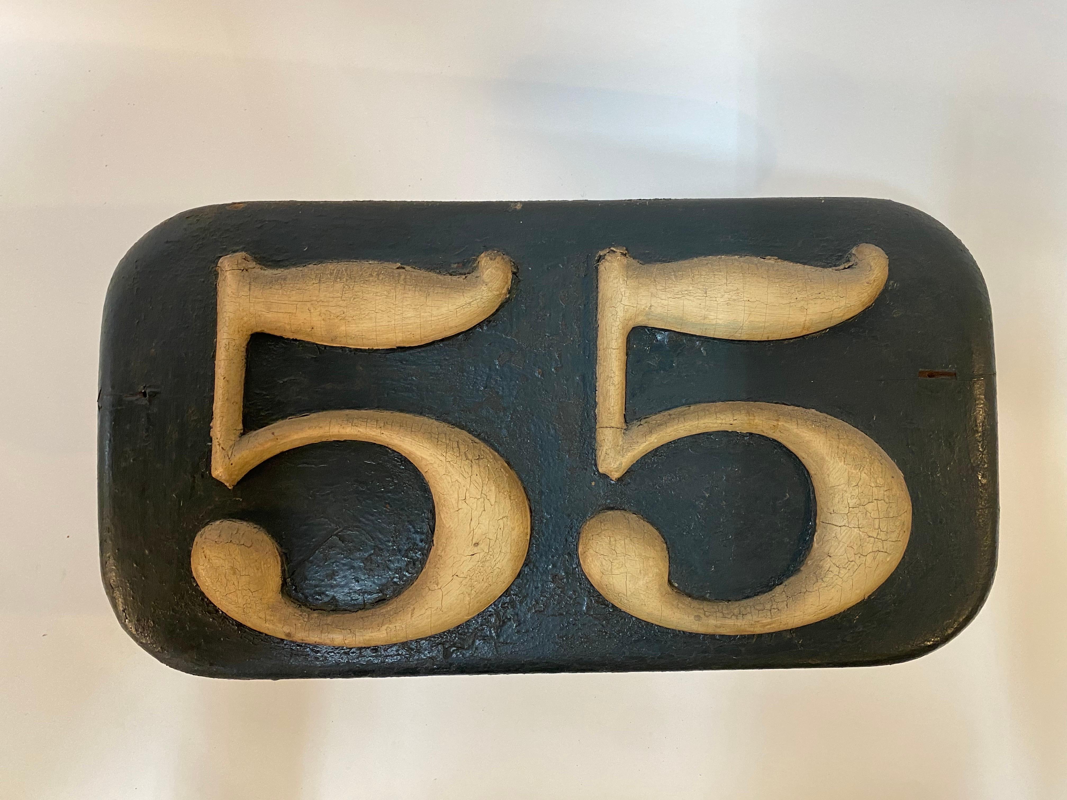 Nineteenth Century '55' wood sign. Old wood relief sign with wonderfully weathered gold and black paint. A nice accent piece or if your address just happens to be 55 Main Street, Anywhere, USA, then this is a beauty of an addition. 

Good overall