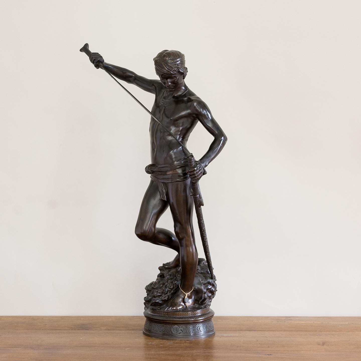 19th century French bronze of David slaying Goliath, cast by Barbedienne after the original by Antonin Mercie, the base signed 'A. Mercie' and 'F. Barbedienne, Fondeur', circa 1875.