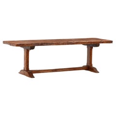 Antique Nineteenth century French Elm farm table with trestle base.