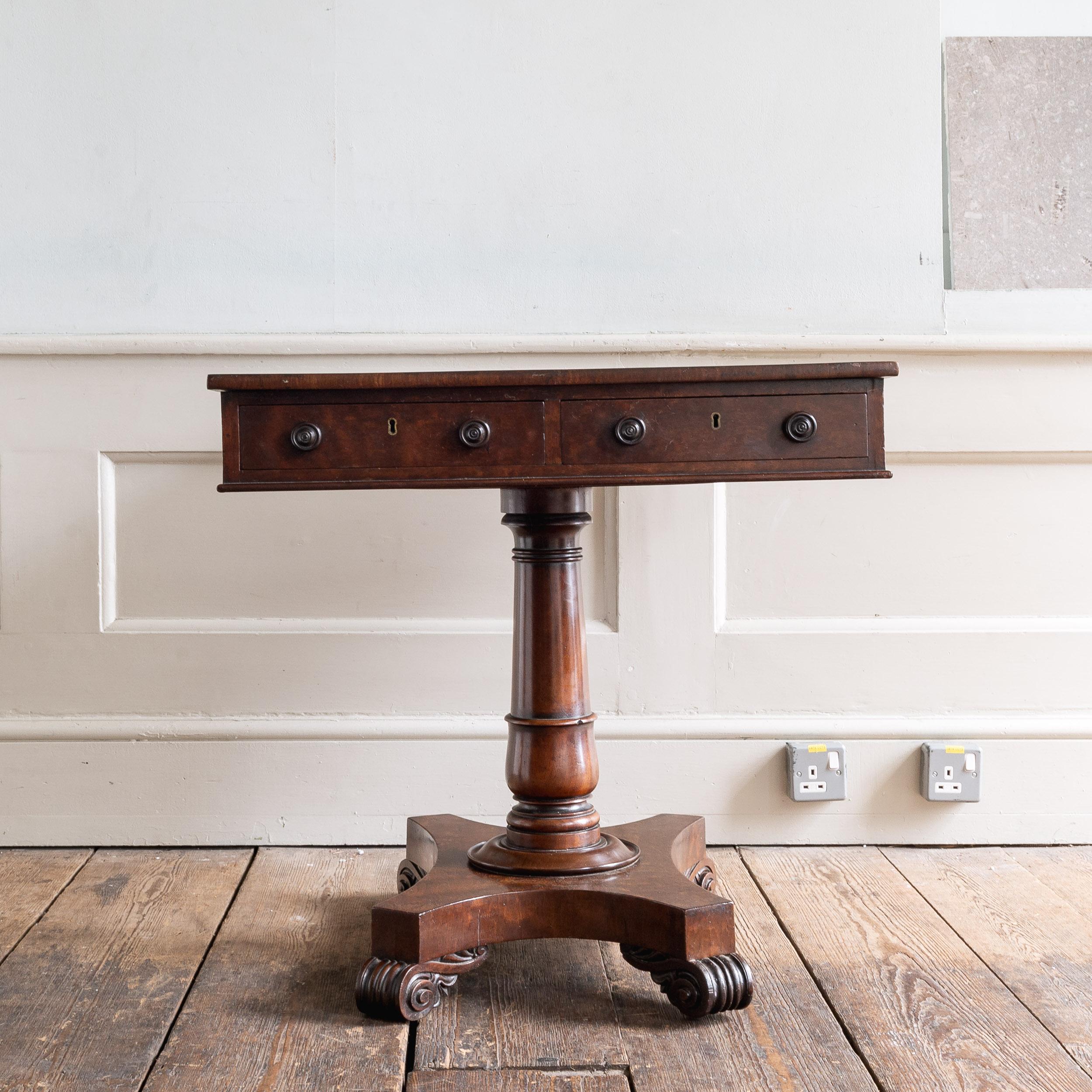 A nineteenth century Sabicu library table, c.1825, in the manner of William Trotter (1772-1833),
of unusual configuration and size, with oppositing drawers to the short sides of the rectangular top, the tapered and turned column with decorative band