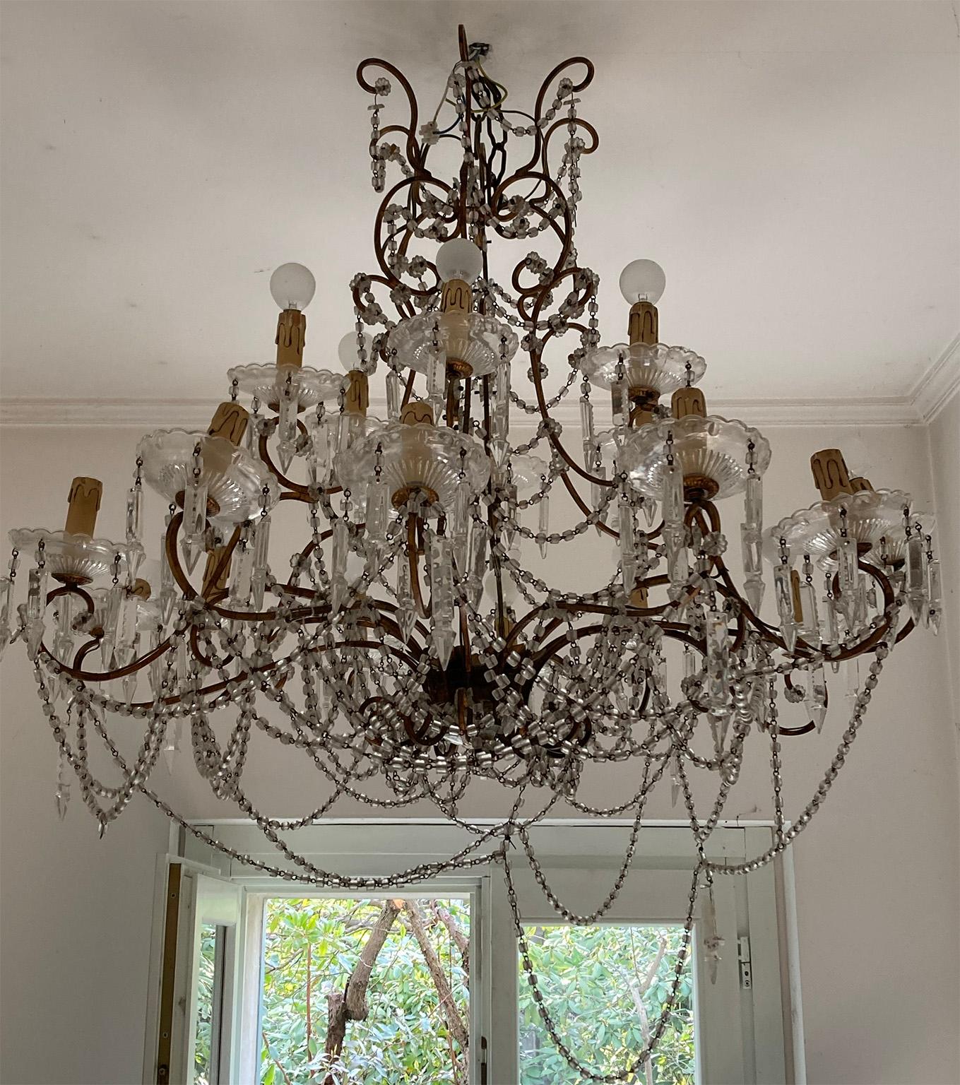 Elegant nineteenth century Sicilian chandelier in gilded metal and crystal.
Provenance: Dimora in Palermo
18 lights arranged in two orders. 
Measures: 85 x 85 cm 
33,46 x 33,46 inches.
    