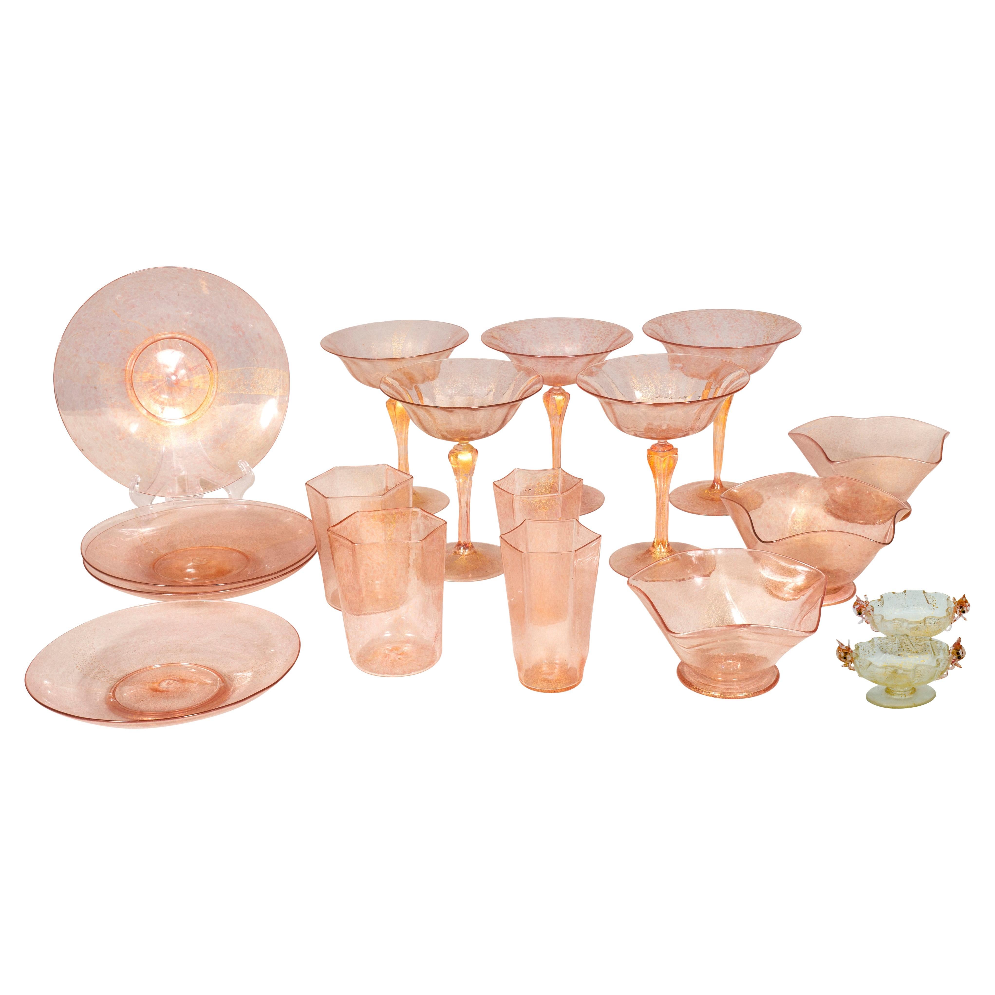In pink and gold. Comprising 27 small octagonal tumblers, 25 larger tumblers, 10 dessert bowls and under plates, 16 champagne, 14 table salts in a different color. 
Purchased in the 1980s in Boston from an antique shop for 6,000.