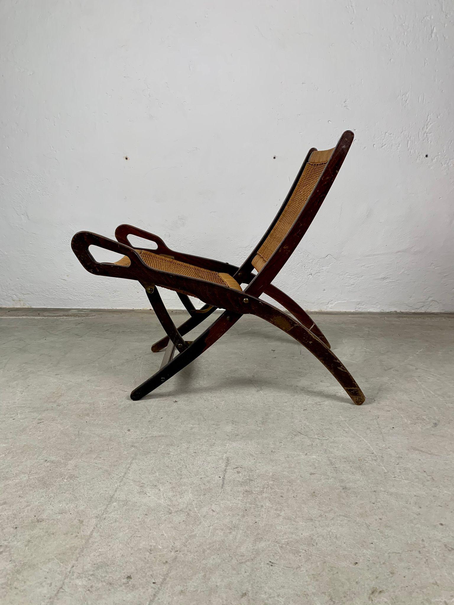 Ninfea armchair with wooden frame and woven straw by Gio Ponti for Reguitti.
Ninfea armchair with wooden frame, metal details and woven straw seat and back. Designed by the great master of Italian design Gio Ponti for the historic Reguitti company.