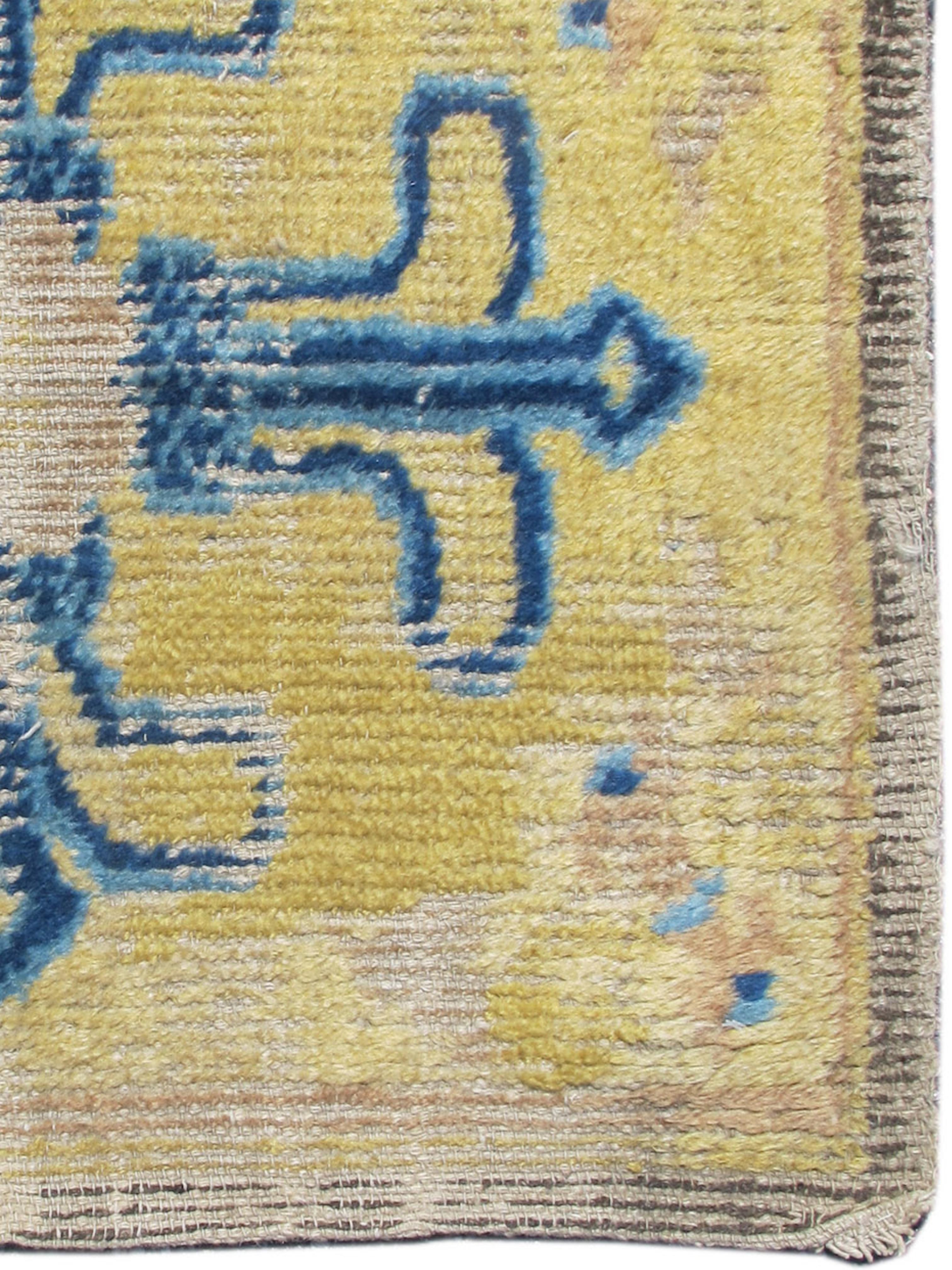 Ningxia Mat, c. 1700

A stylized ‘dorje’ or ‘vajra’ is drawn with tone on tone blues against a vibrant gold yellow ground filling the field of this Chinese seating square woven in the Ningxia district. The vajra (Sanskrit) or dorje (Tibetan) is a