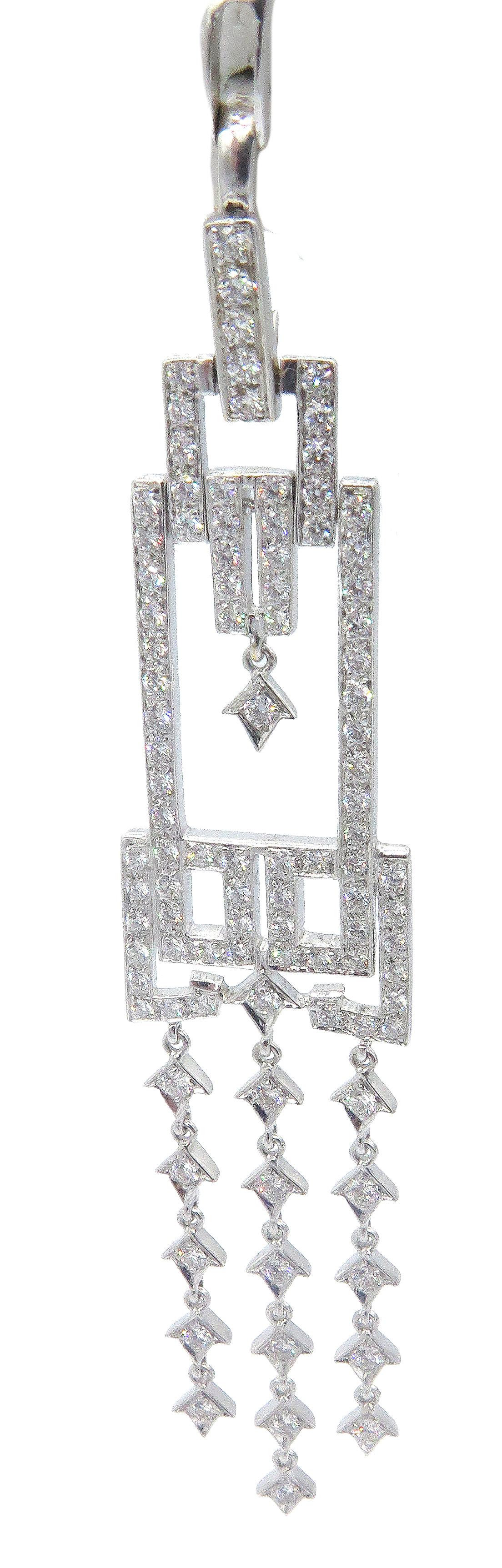 Beautifully, designed art deco diamond pendant by NINI. Made in 18k white gold with a beautiful setting and selection of round small diamonds that cover and brighten this gorgeous pendant. The pendant is 3.5