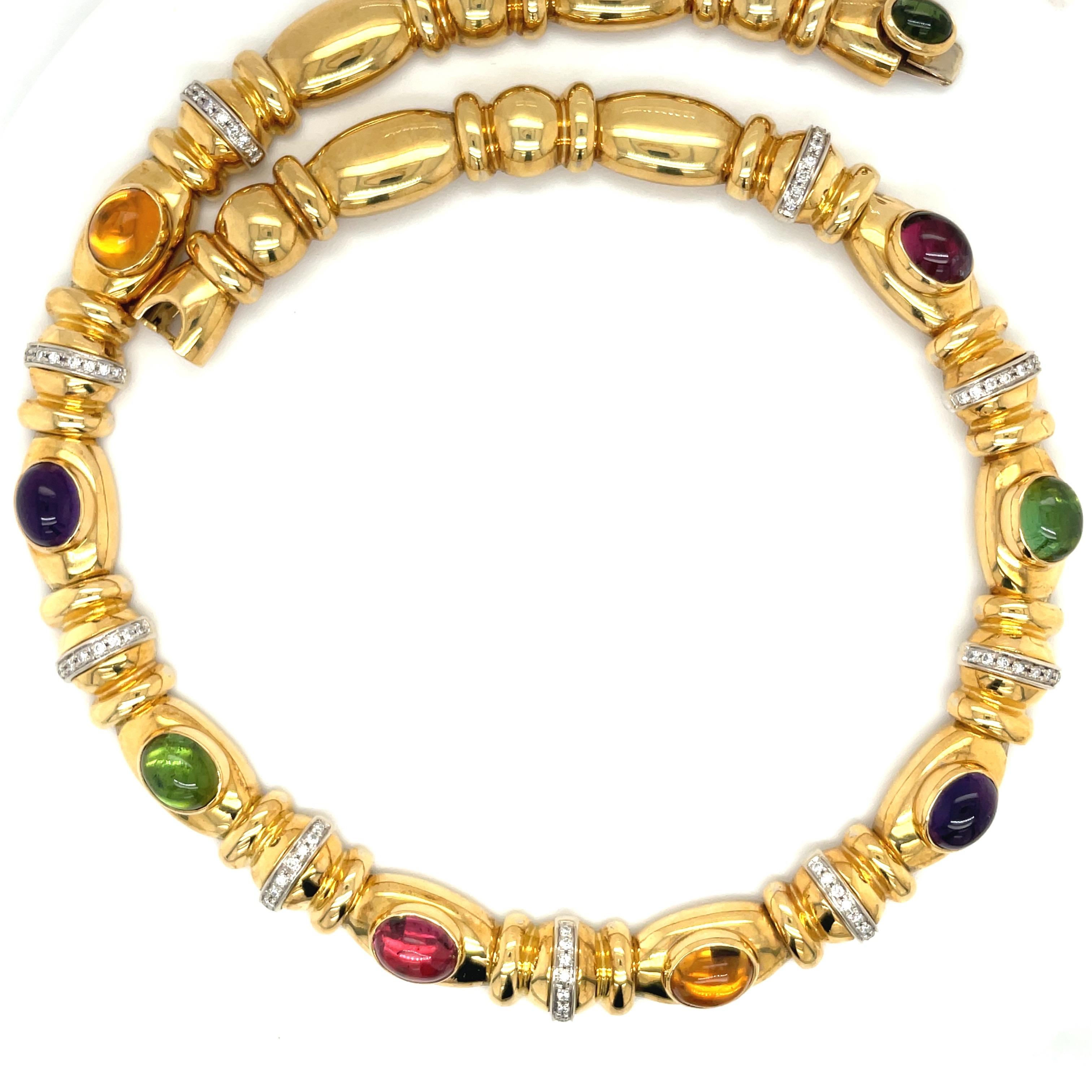 Designed by Nino Verita of Italy , this 18 karat yellow gold necklace is a true classic. The necklace is set with 8 bezel set cabochon semi precious stones of citrine, amethyst, pink & green tourmaline. Eight white gold diamond 0.90 carat rondelles