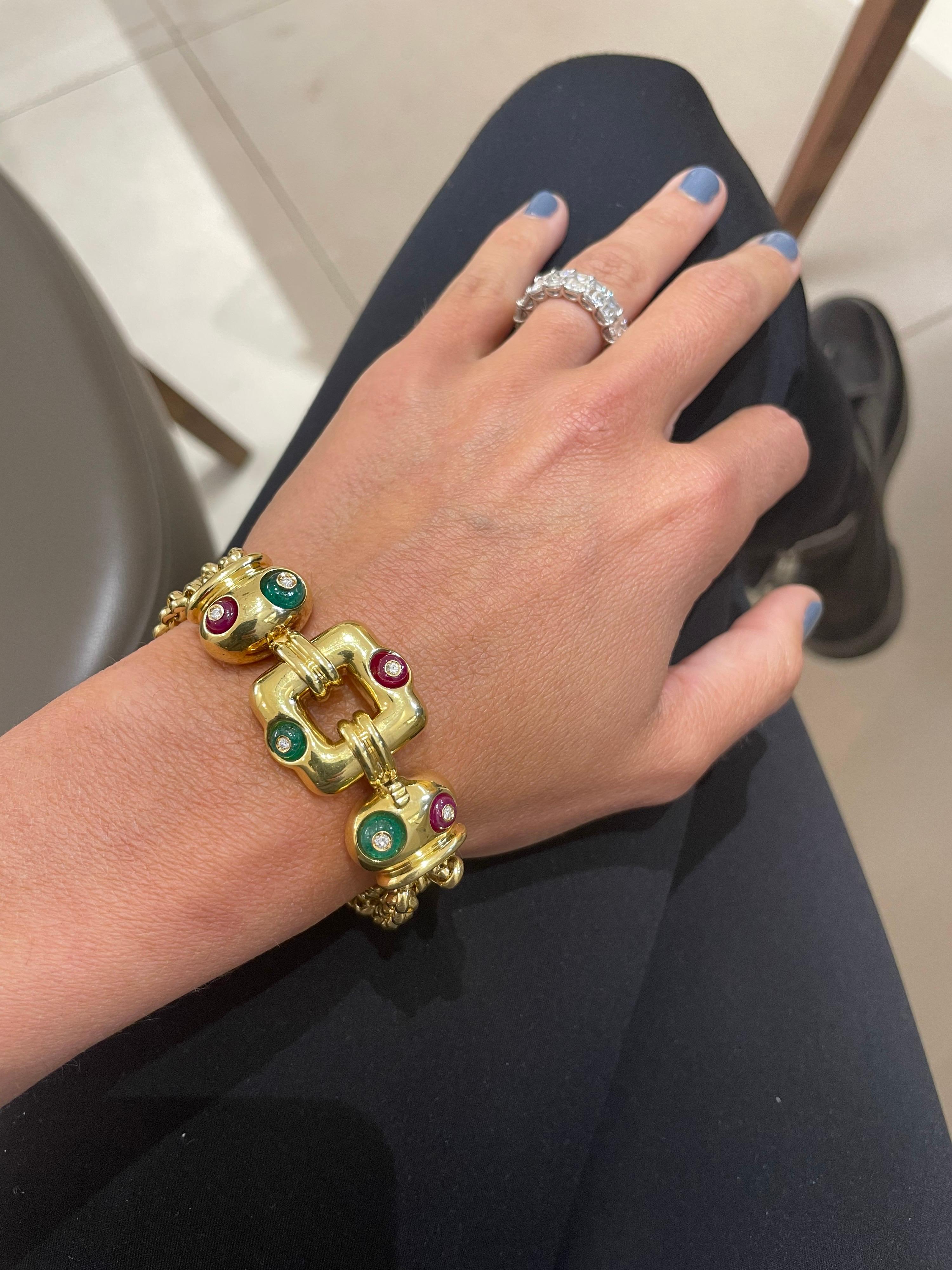 A combination of 3 high polished yellow gold geometric links and 3 chains make up this classic yet fun and extremely wearable bracelet. Each of the geometric links are set with a beaded gemstone of ruby and emerald , then topped with a bezel set