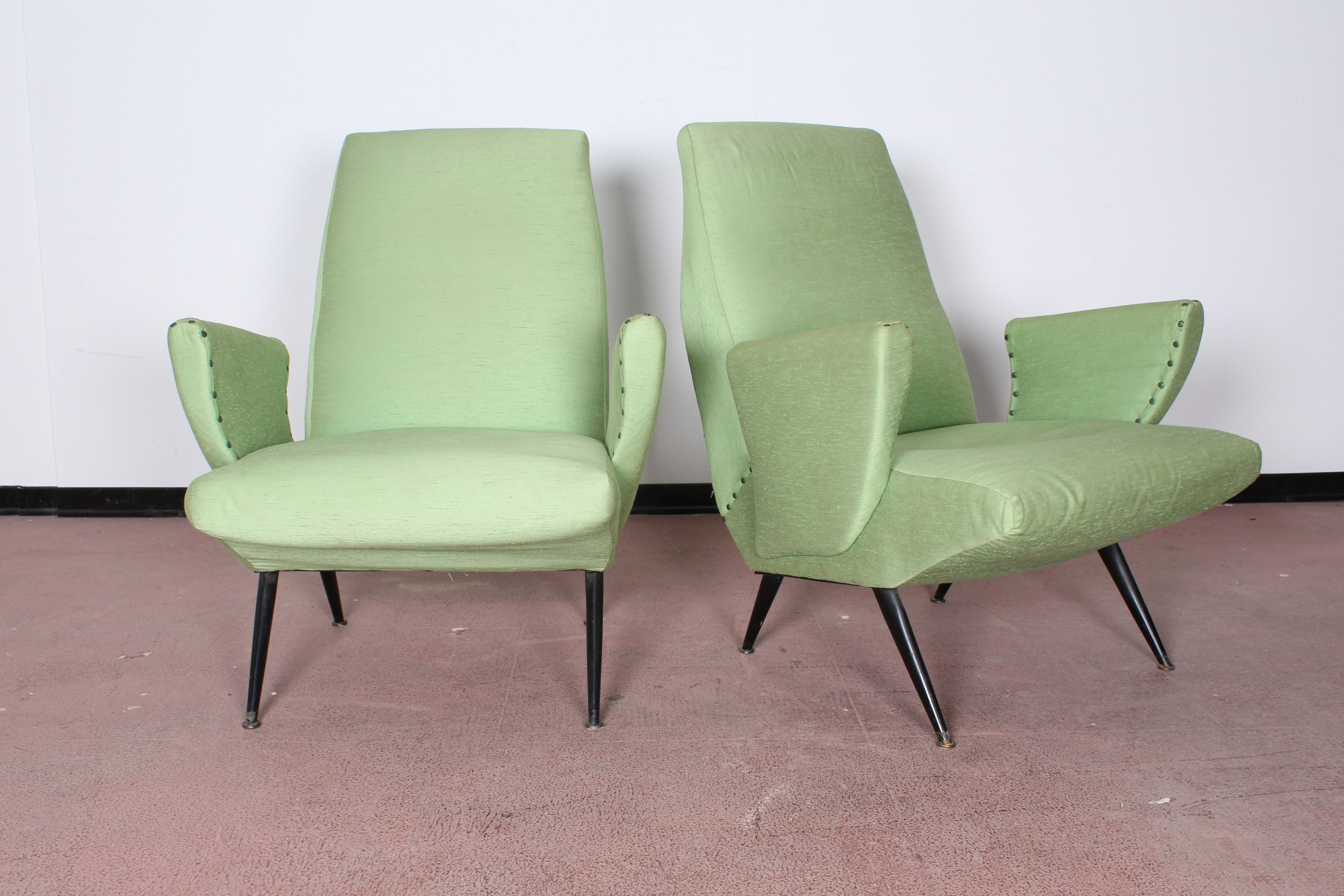 A  beautiful Pair of Nino Zoncada armchair ,original light green fabric and black metal legs. Manufactured in Italy, 1950s.
 Wear consistent with age and use.