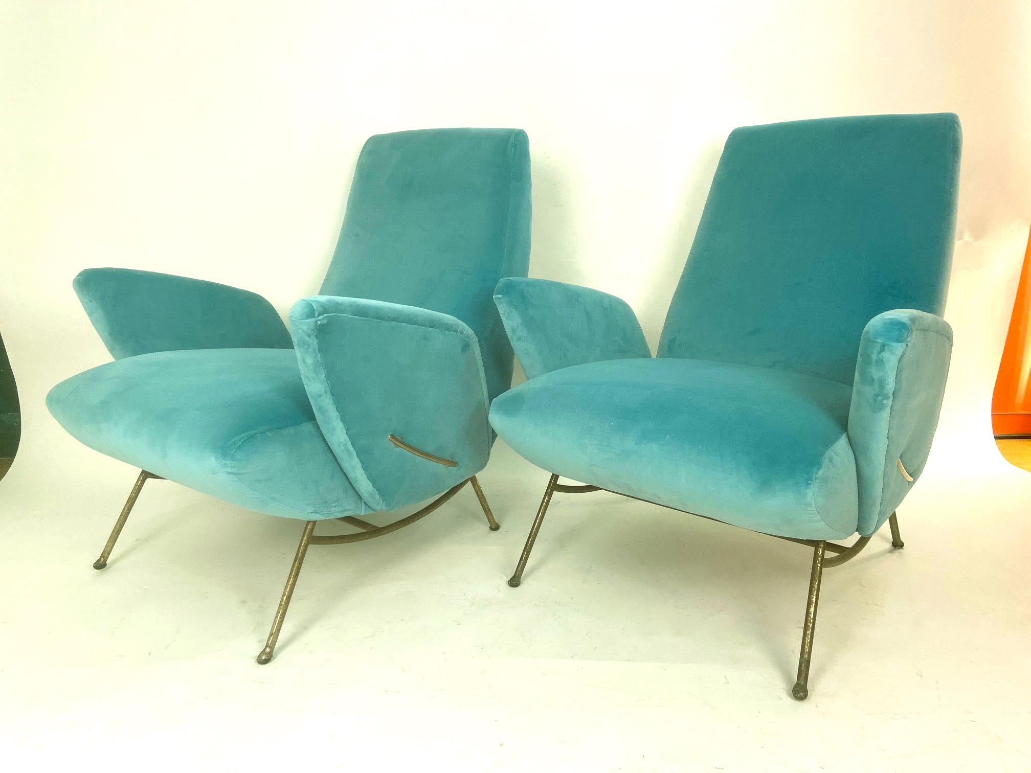 A set of Italian midcentury turquoise blue original armchairs designed by Nino Zoncada. Iron base and brass fittings Reupholstered in turquoise blue velvet. Extremely comfortable and beautiful.