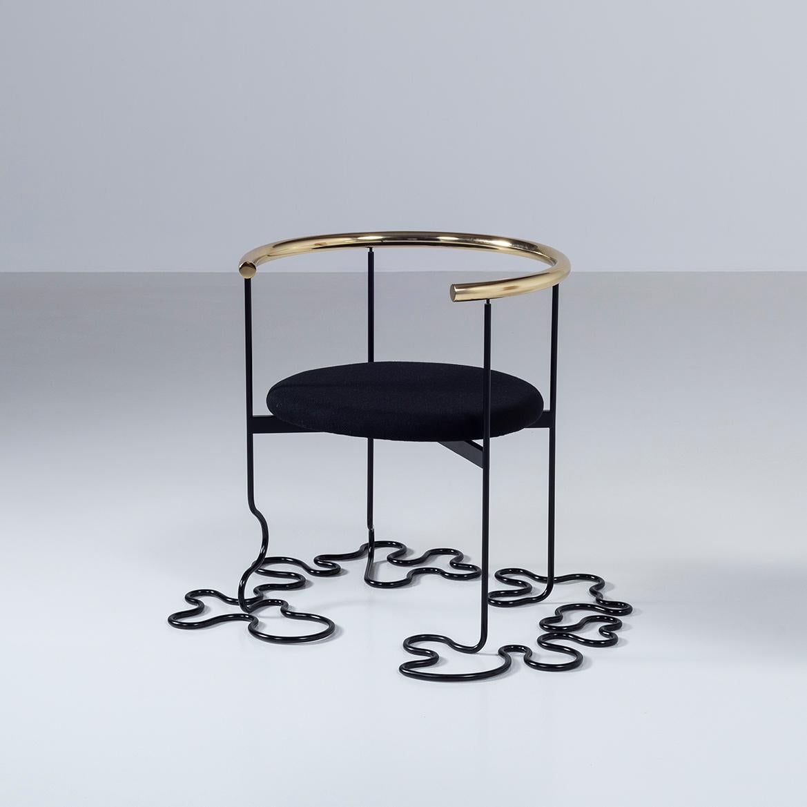 One of the shapes that the black pipe chairs designed by Uchida have reached while evolving and being transformed by the momentum of the 1980s. 

Frame: steel melamine baking black finish
Arm: gold plated
Seat: upholstering.