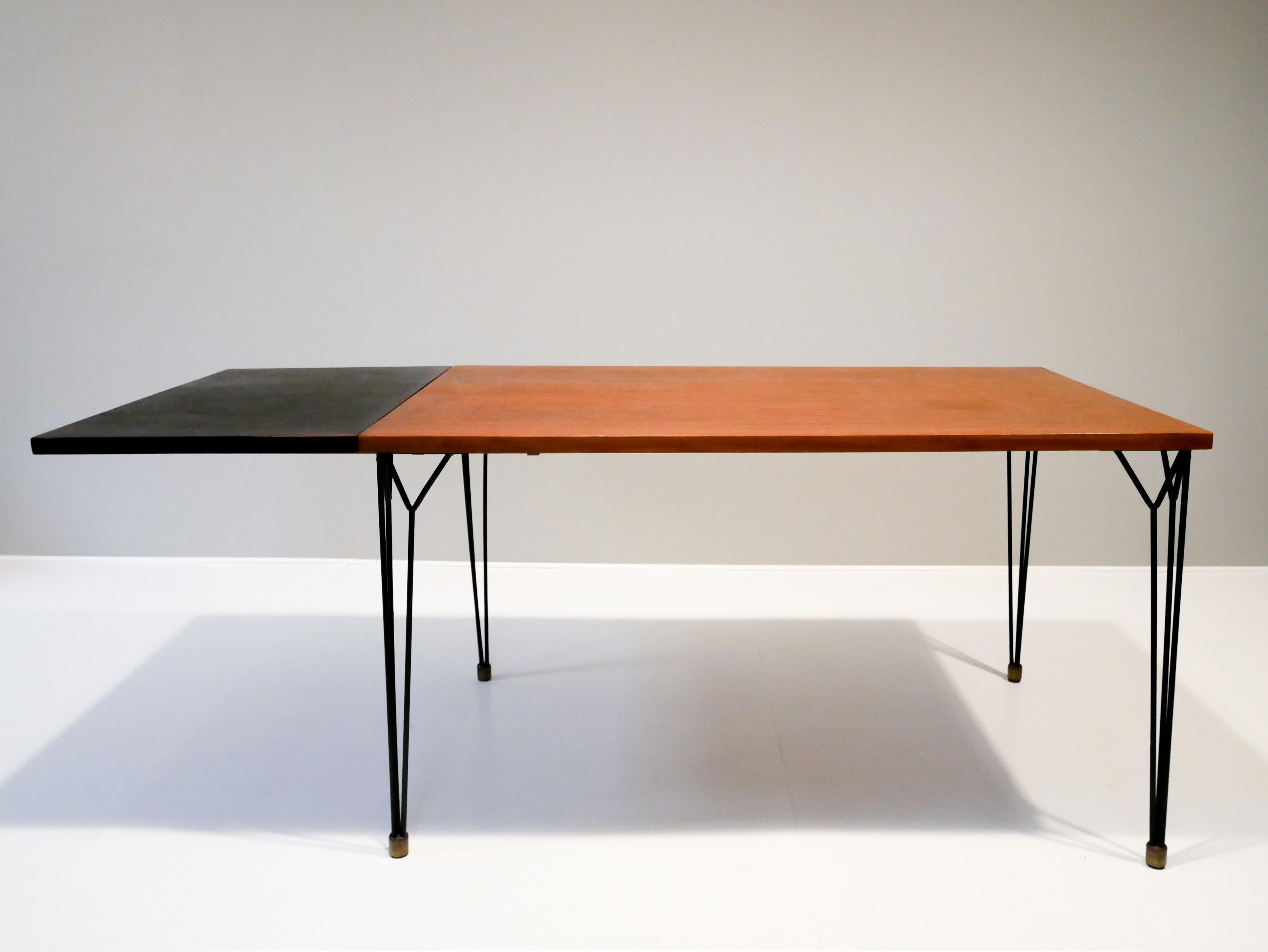 Very rare Nisse strinning dining table in teak and blackened extending leaf.
Dimensions on the leaf are 80x50 cm 
So the in total the table can extend to 180x80 cm.  