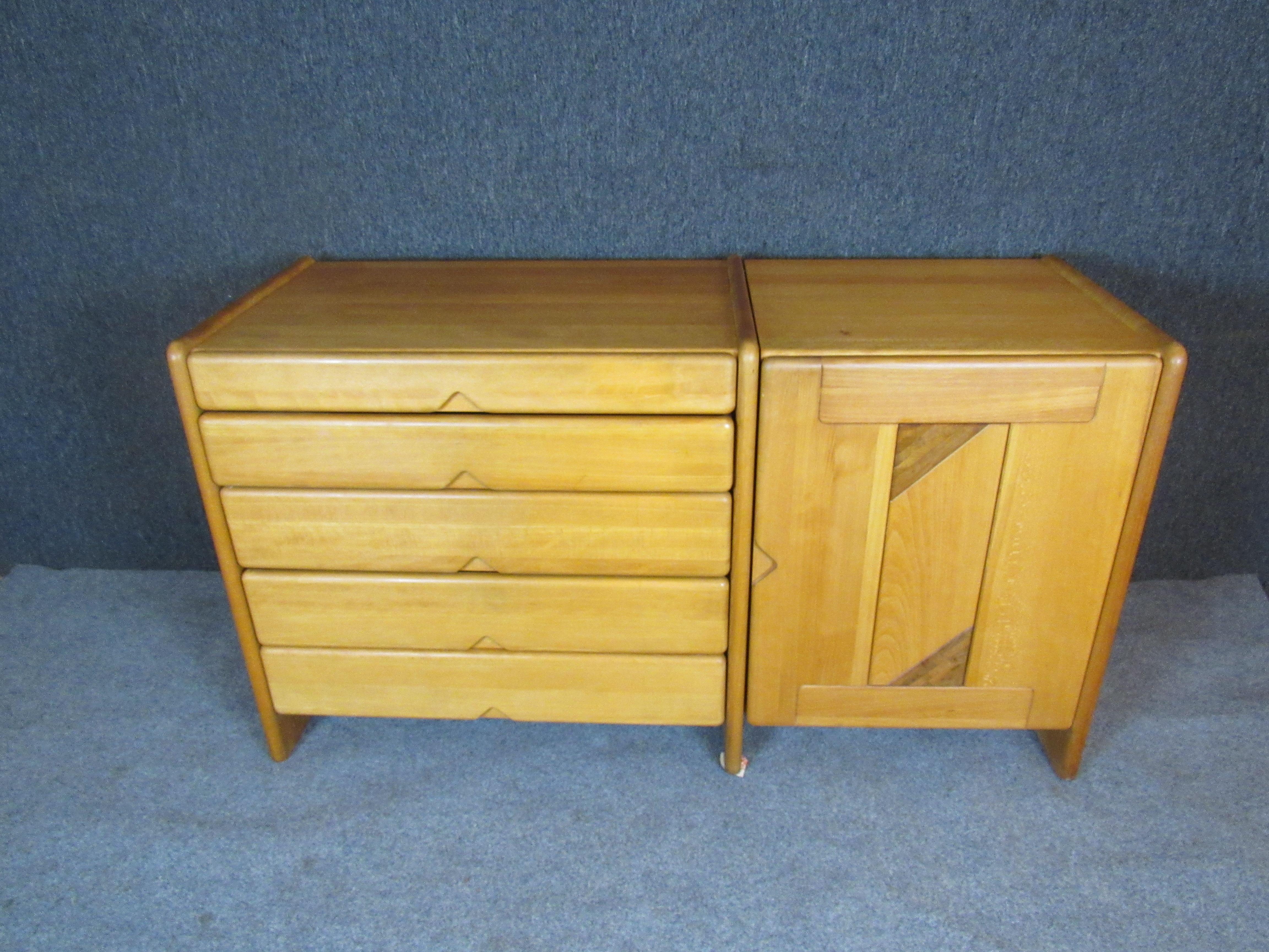 This piece designed by Soren Nissen and Ebbe Gehl for Seltz is a great modern form dresser. Faded hardwood frame with inlay dark wood design door. The dresser drawers have a triangle notch for handle use. The cabinet side is open and can accommodate