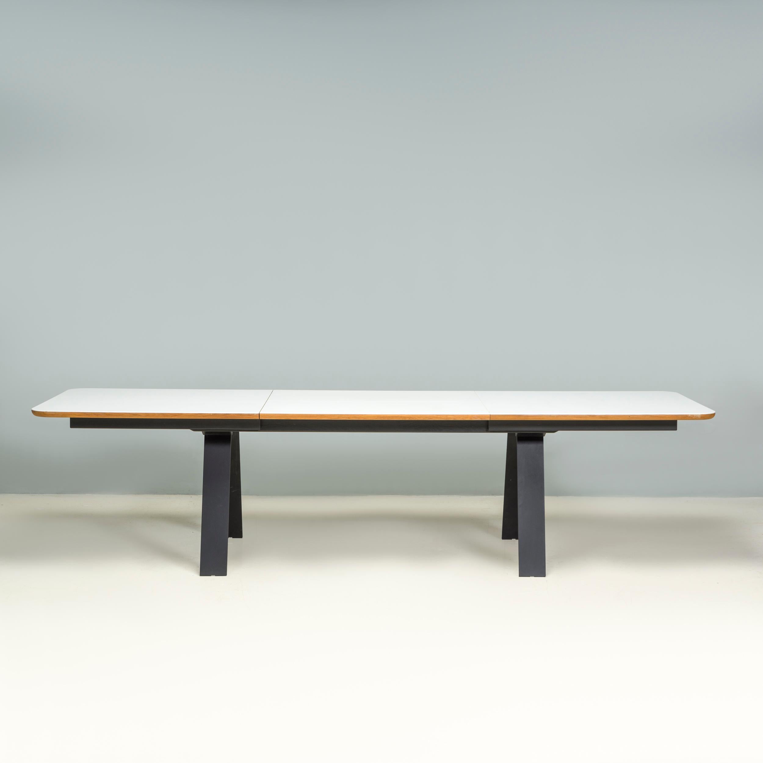 Designed by Ebbe Gehl and Søren Nissen for Naver, this Chess dining table was manufactured in Denmark in 2018.

The dining table has a large rectangular top with rounded corners in white Corian with a contrasting walnut finish around the edge.

With