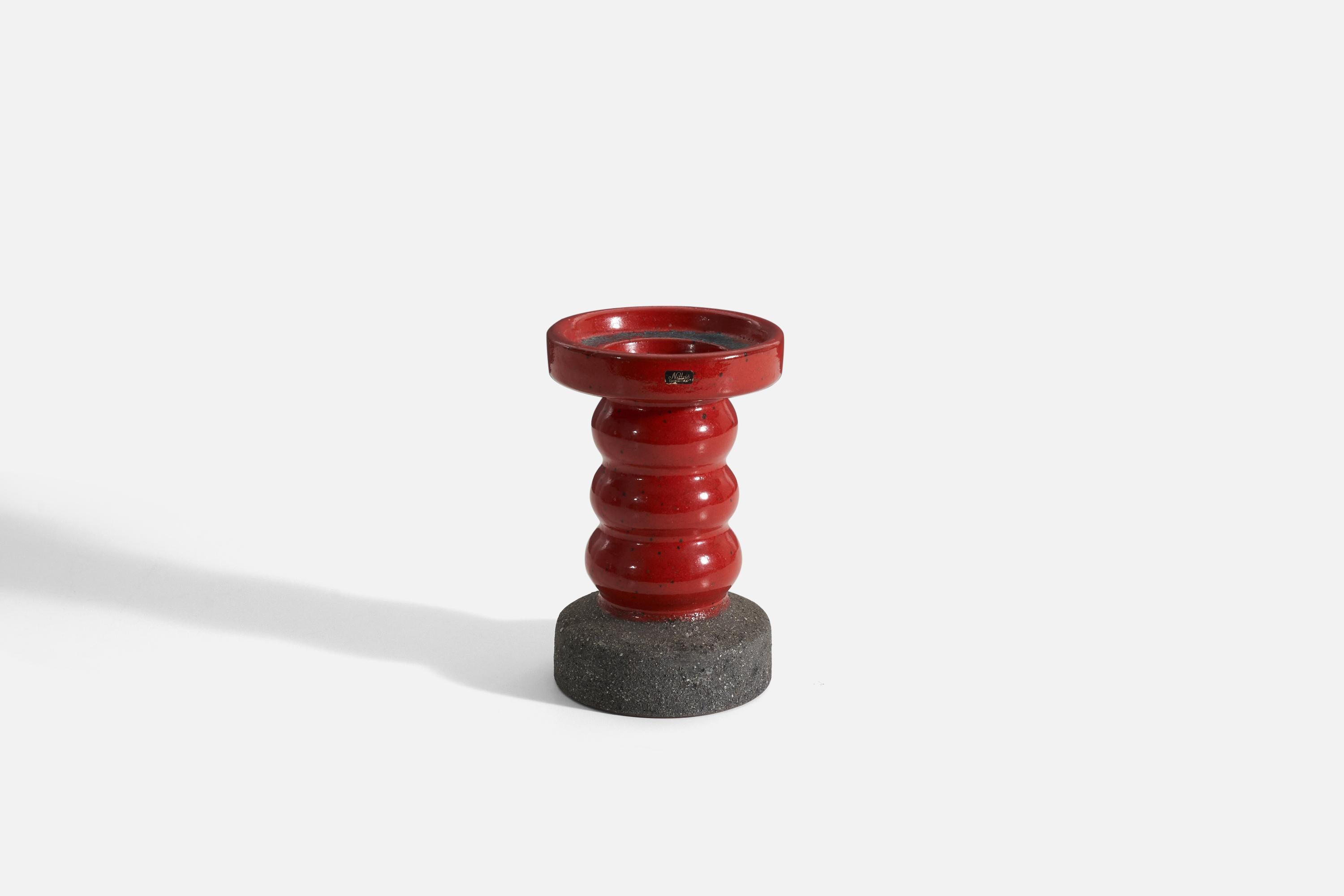 A red semi-glazed earthenware candle stick holder by Nittsjö, produced in Sweden, 1940s.
 