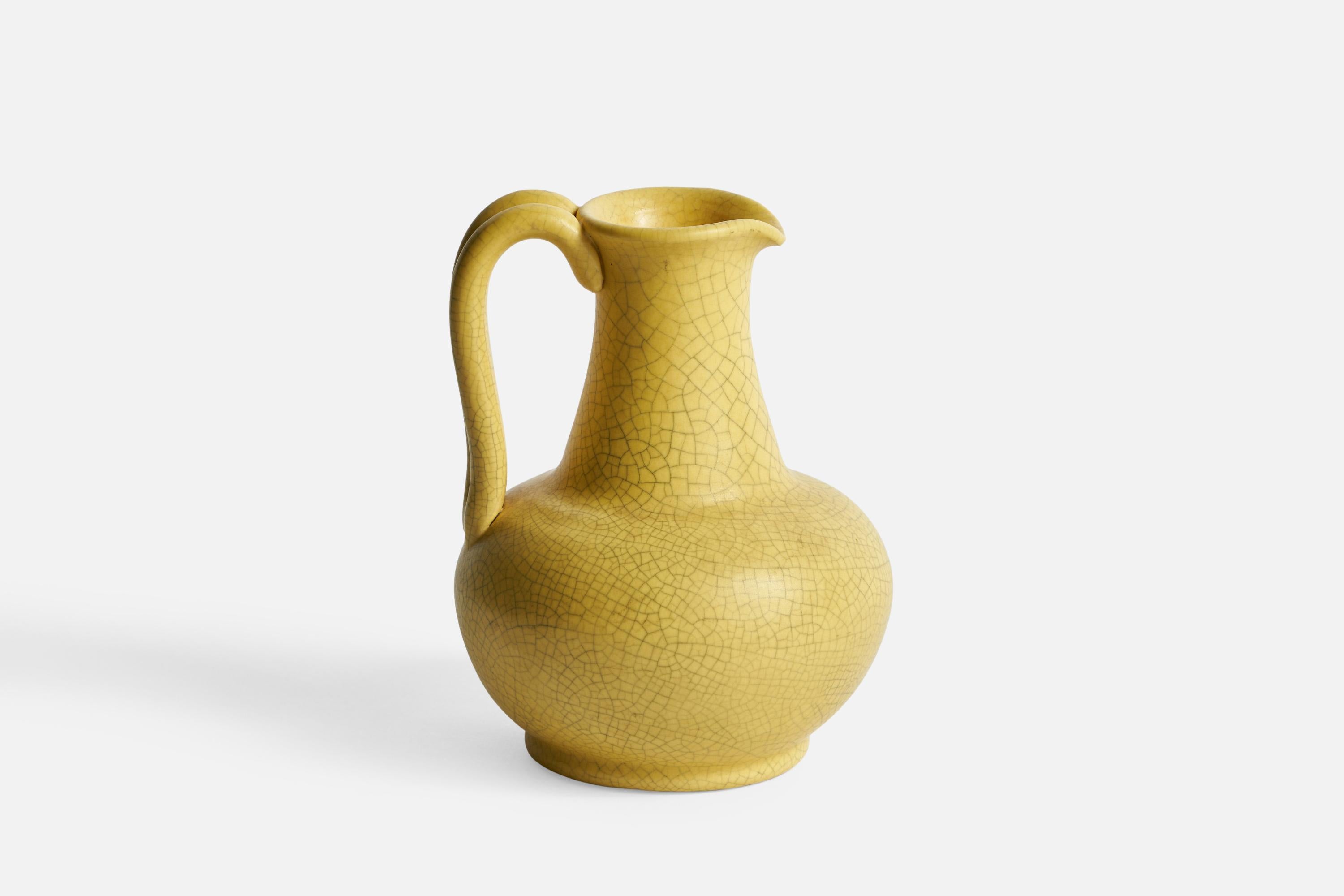 A small yellow-glazed ceramic pitcher designed and produced by Nittsjö, Sweden, 1930s.