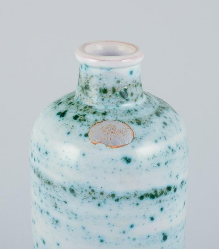 Scandinavian Modern Nittsjö, Sweden, ceramic vase. Green shaded glaze on a white base. For Sale