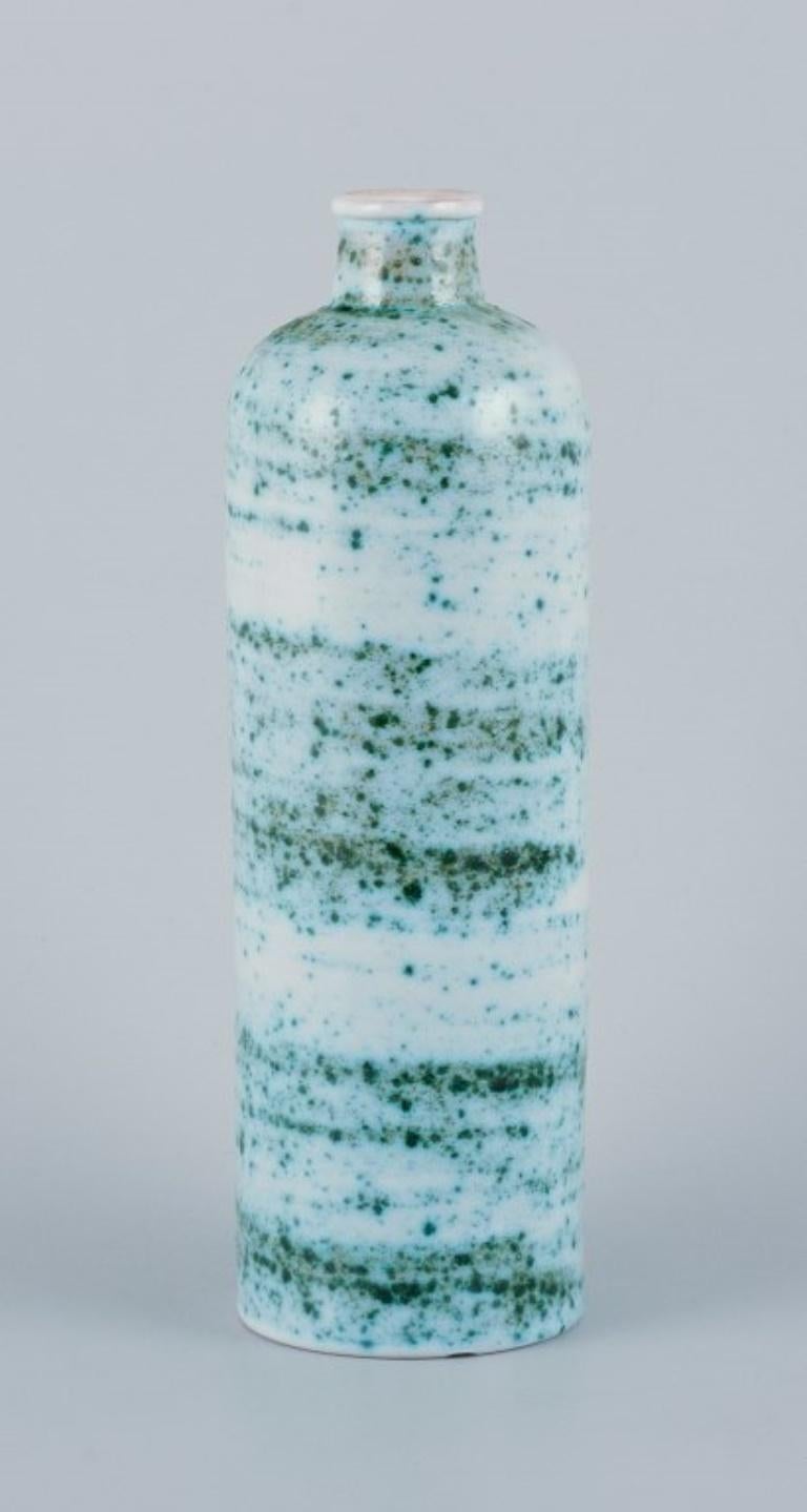 Swedish Nittsjö, Sweden, ceramic vase. Green shaded glaze on a white base. For Sale