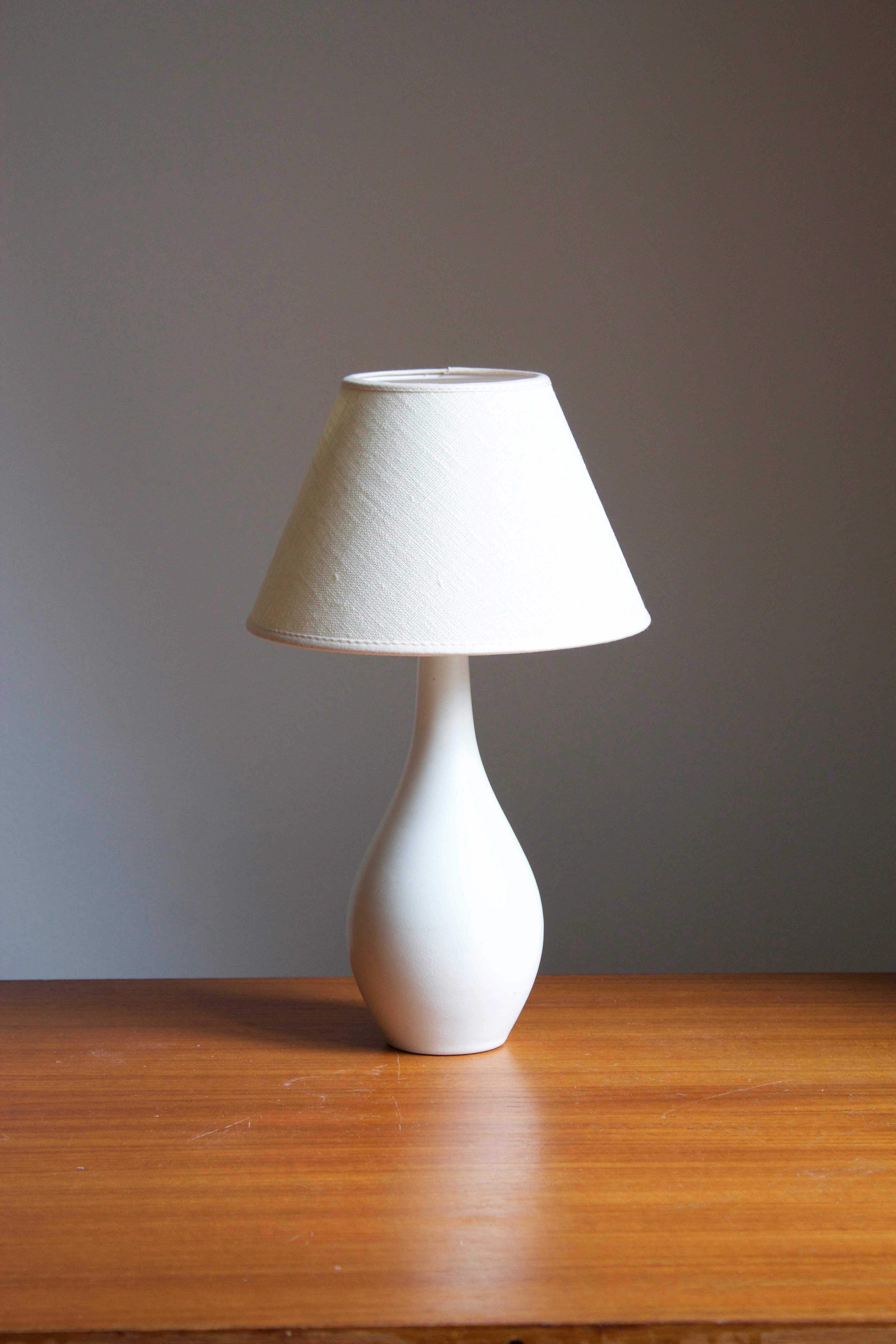 A produced by Nittsjö, Sweden, 1930s.

Stated dimensions exclude the lampshade. Sold without lampshade.

Glaze features a white color.

Other designers of the period include Axel Salto, Paavo Tynell, Lisa Johansson-Pape, Carl-Harry Stålhane, and