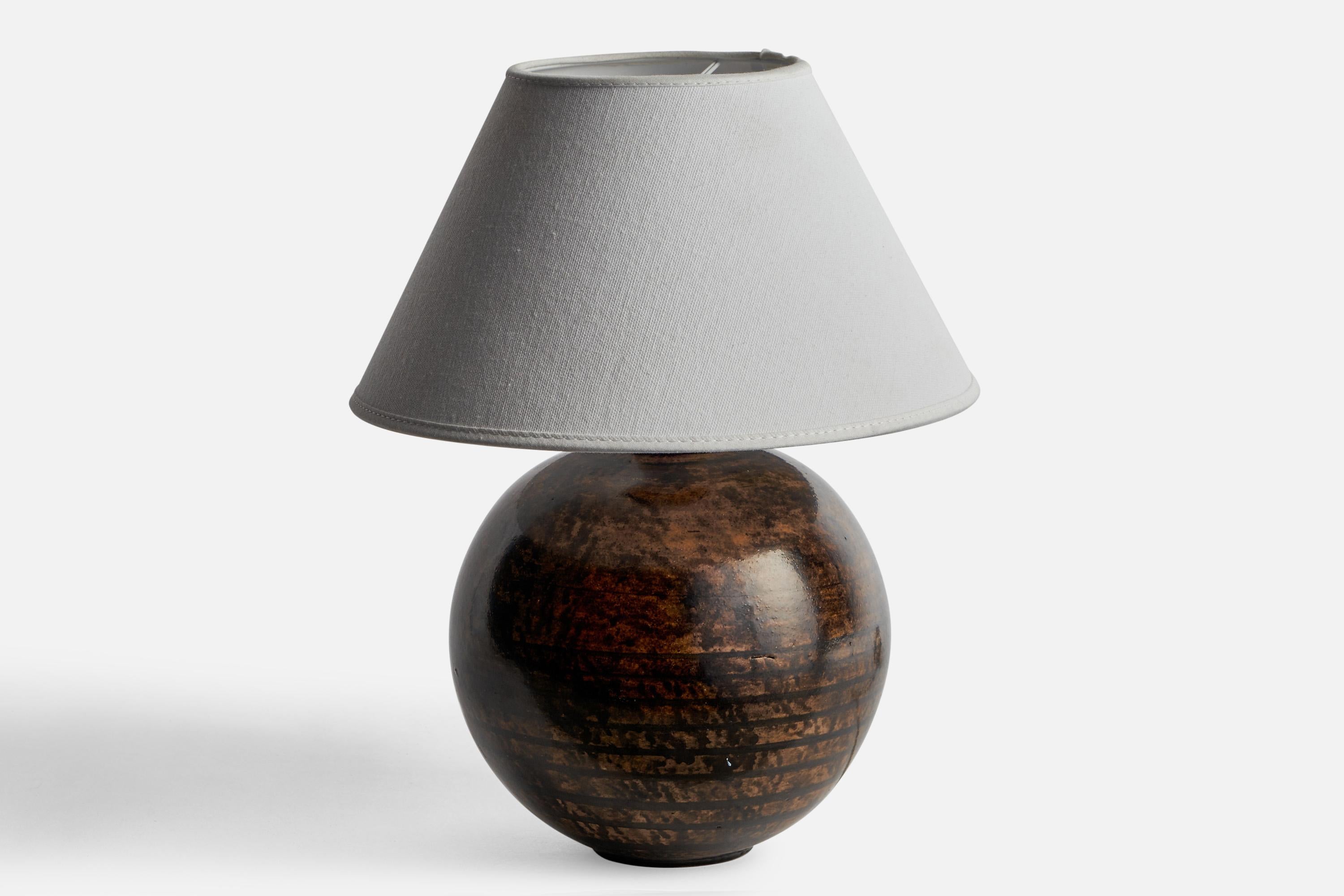 A brown and black-glazed ceramic table lamp designed and produced in Sweden, 1930s.

Dimensions of Lamp (inches): 8.95” H x 6.85” Diameter
Dimensions of Shade (inches): 4.5” Top Diameter x 10” Bottom Diameter x 5.25” H
Dimensions of Lamp with Shade
