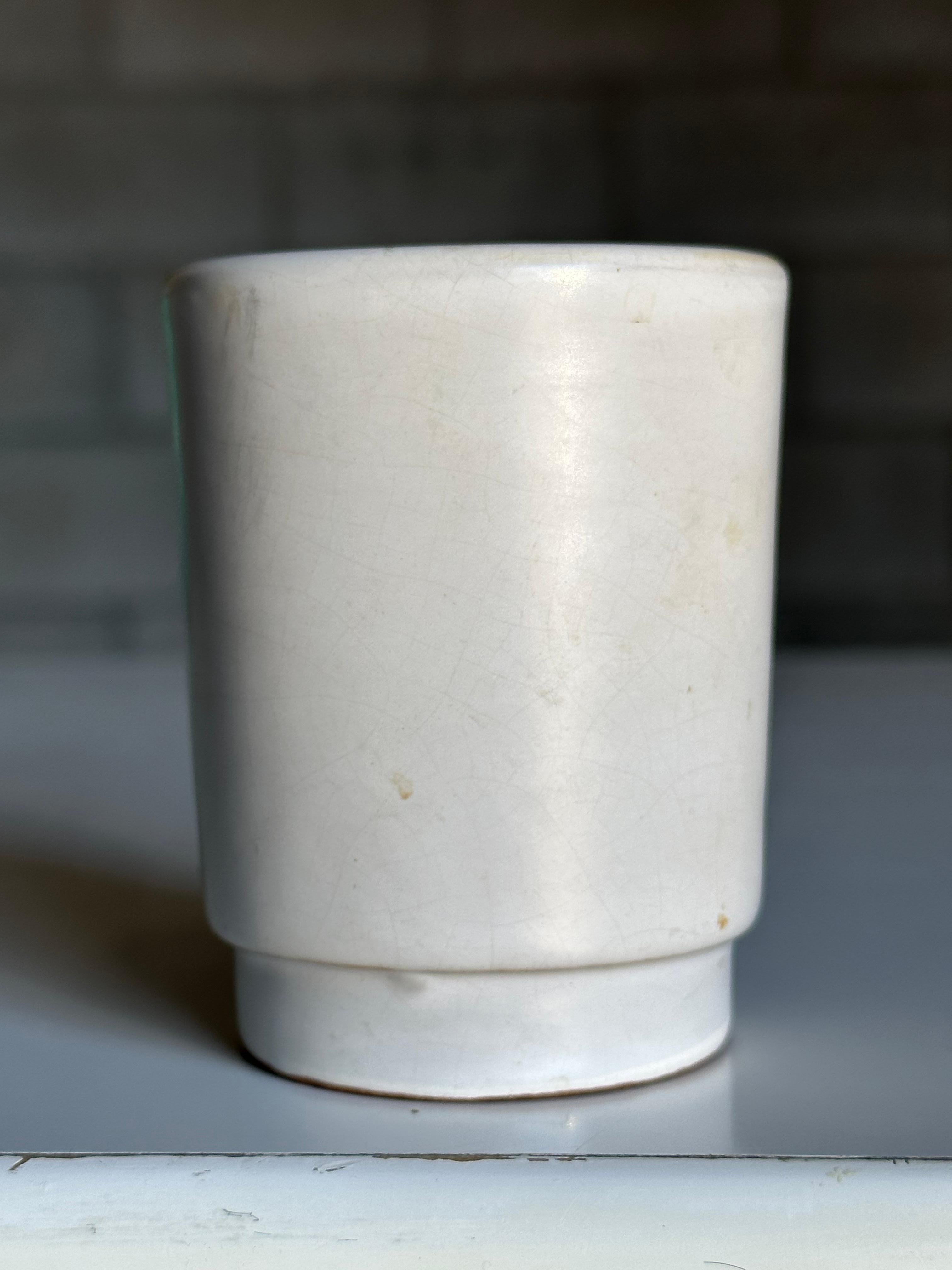 A wonderful small vase produced by Nittsjö and attributed to Jerk Werkmäster. Great classic form vase with minimalist palette would allow for use in a variety of interior decors- minimalist, modern, contemporary, organic modern, Scandinavian, etc. 
