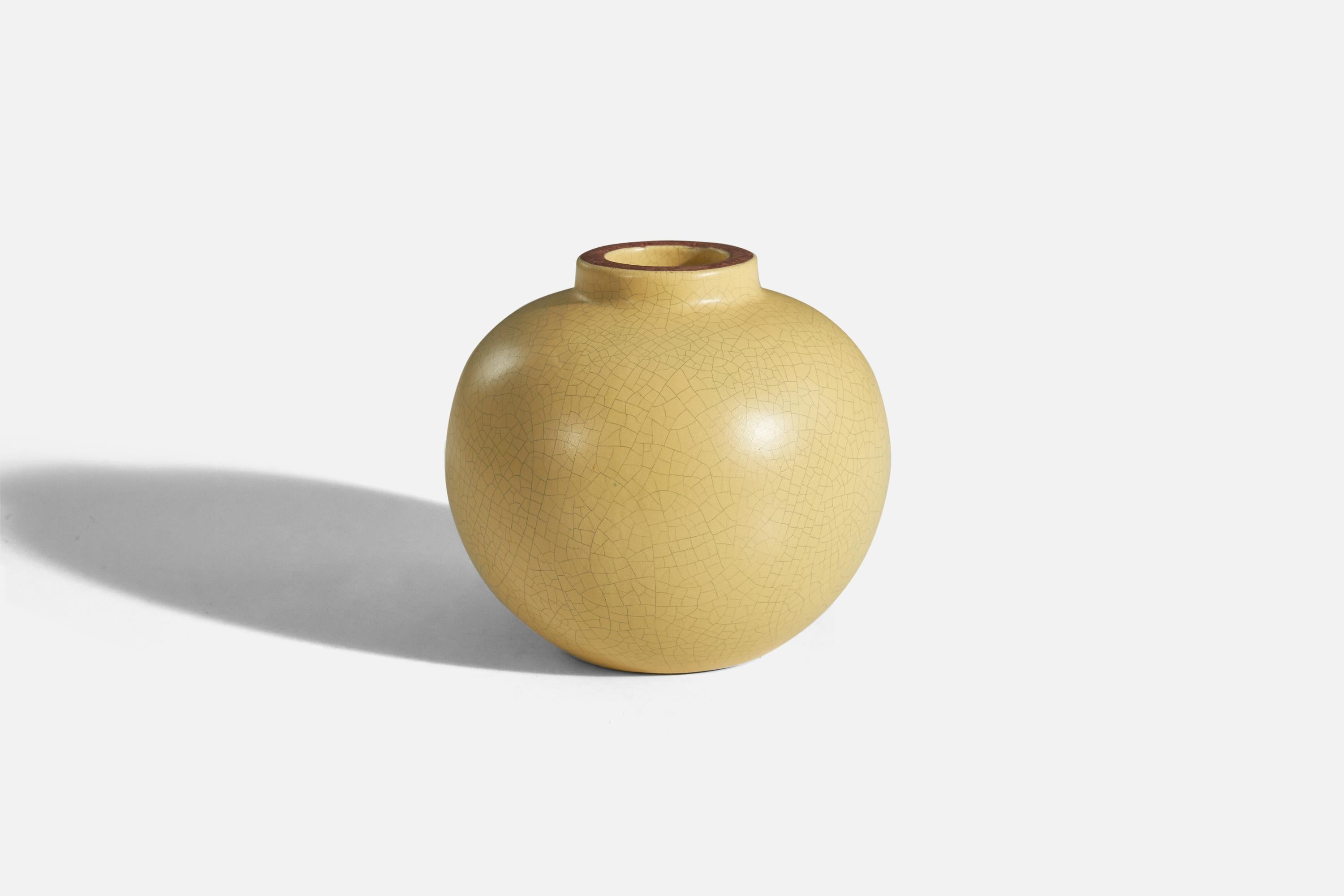 A yellow, glazed earthenware vase designed and produced by Nittsjö, Sweden, 1940s.
  