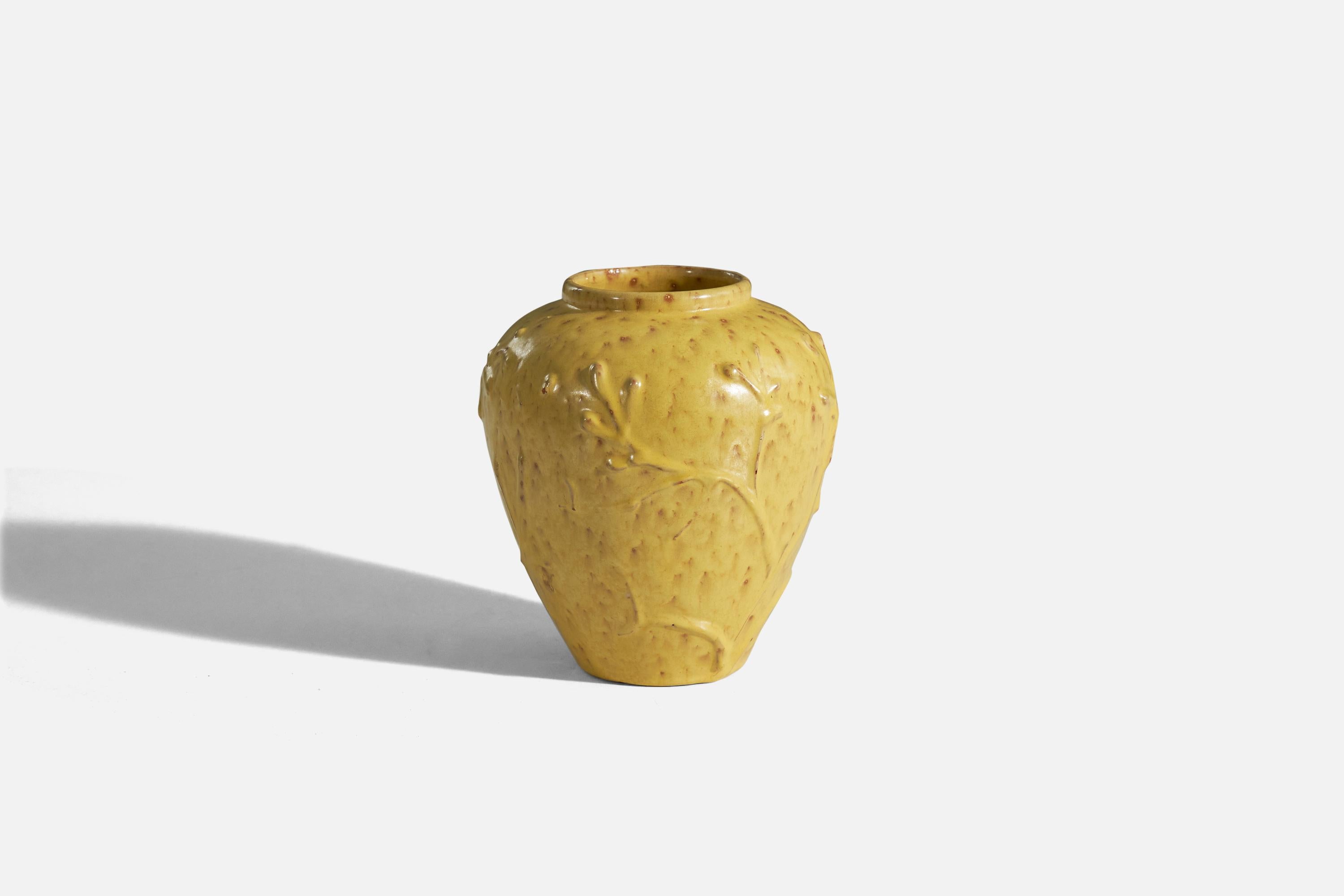 A yellow, glazed earthenware vase designed and produced by Nittsjö, Sweden, 1940s.
  