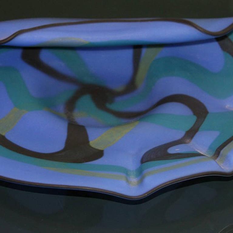 This frosted fused glass is an expressionist sculpture that's organic in shape.  The analogous colors create a serene design.  Signature inscribed 'Nivet'.
