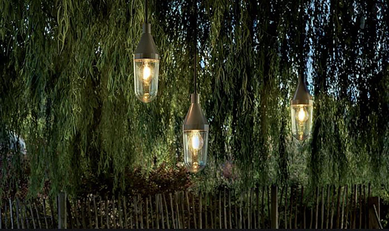 Niwa outdoor lamp by Christophe Pillet for Oluce. The light bulb is protected in a transparent blown-glass diffuser connected to a lacquered aluminum cone. 1 x max 15 W - E26 (LED) as lamp type. 

Dimensions:
10cm W x 30cm L (1000cm cable length).