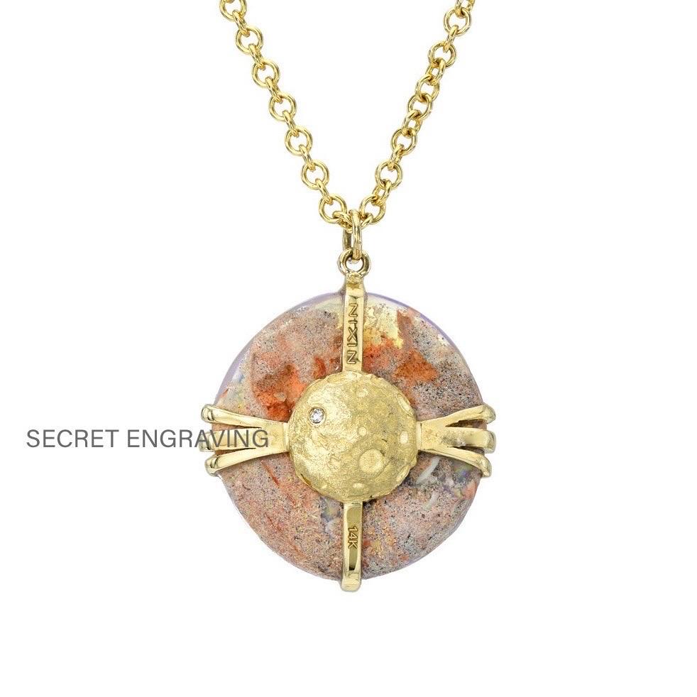 A mystical orb of lunar wonder enchants in this Australian Opal Necklace. Suspended in gold and studded with diamonds, the opal pendant radiates an aura of iridescent hues. Its cosmic landscape emerges through the crystal opal as vibrant pink, blue