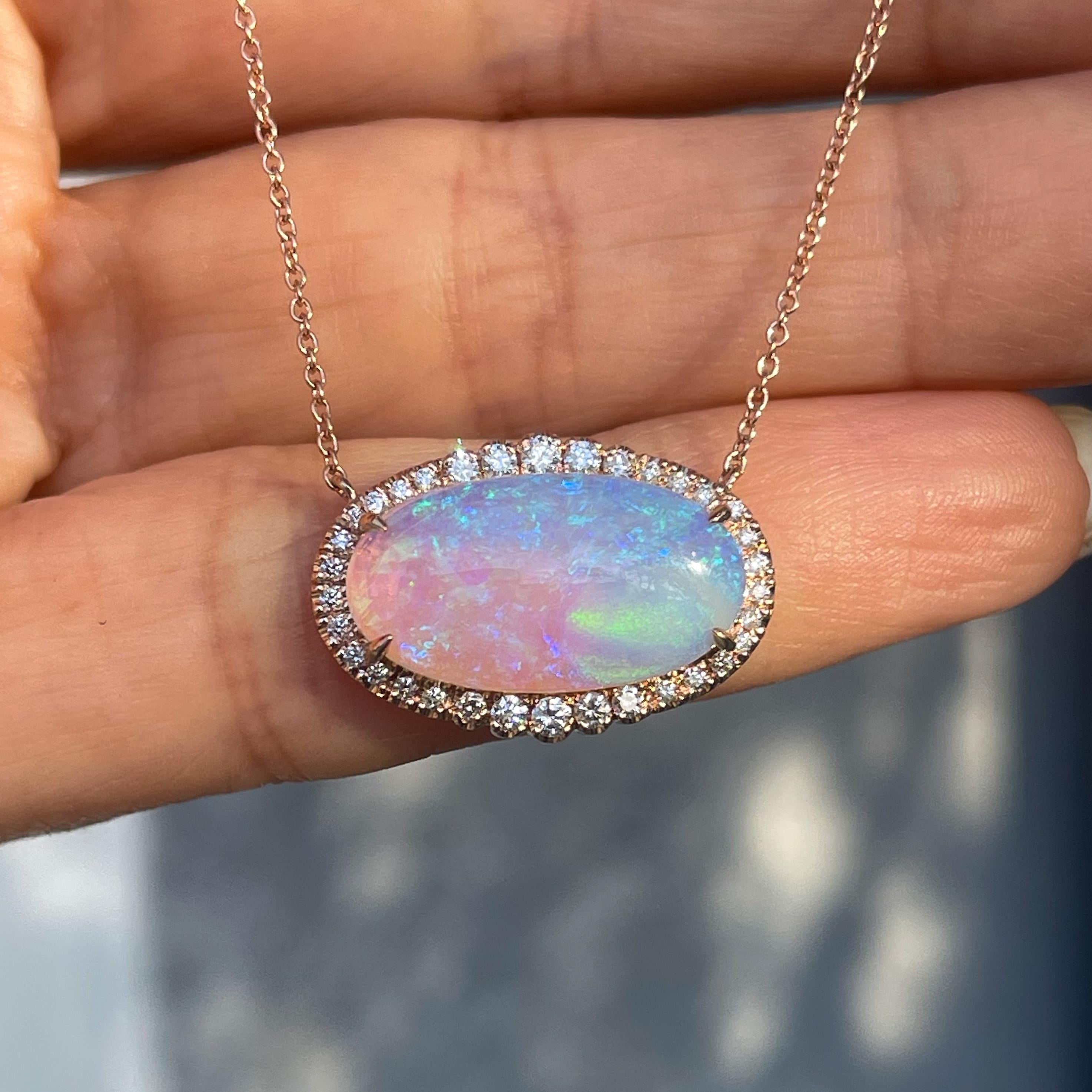 Swirling within this Australian Opal Necklace is an otherworldly scene. A stunning green nebula floats within a crystal opal, encircled by a diamond halo. The elongated stone is set east west, filling a panoramic skyscape with soft shades of
