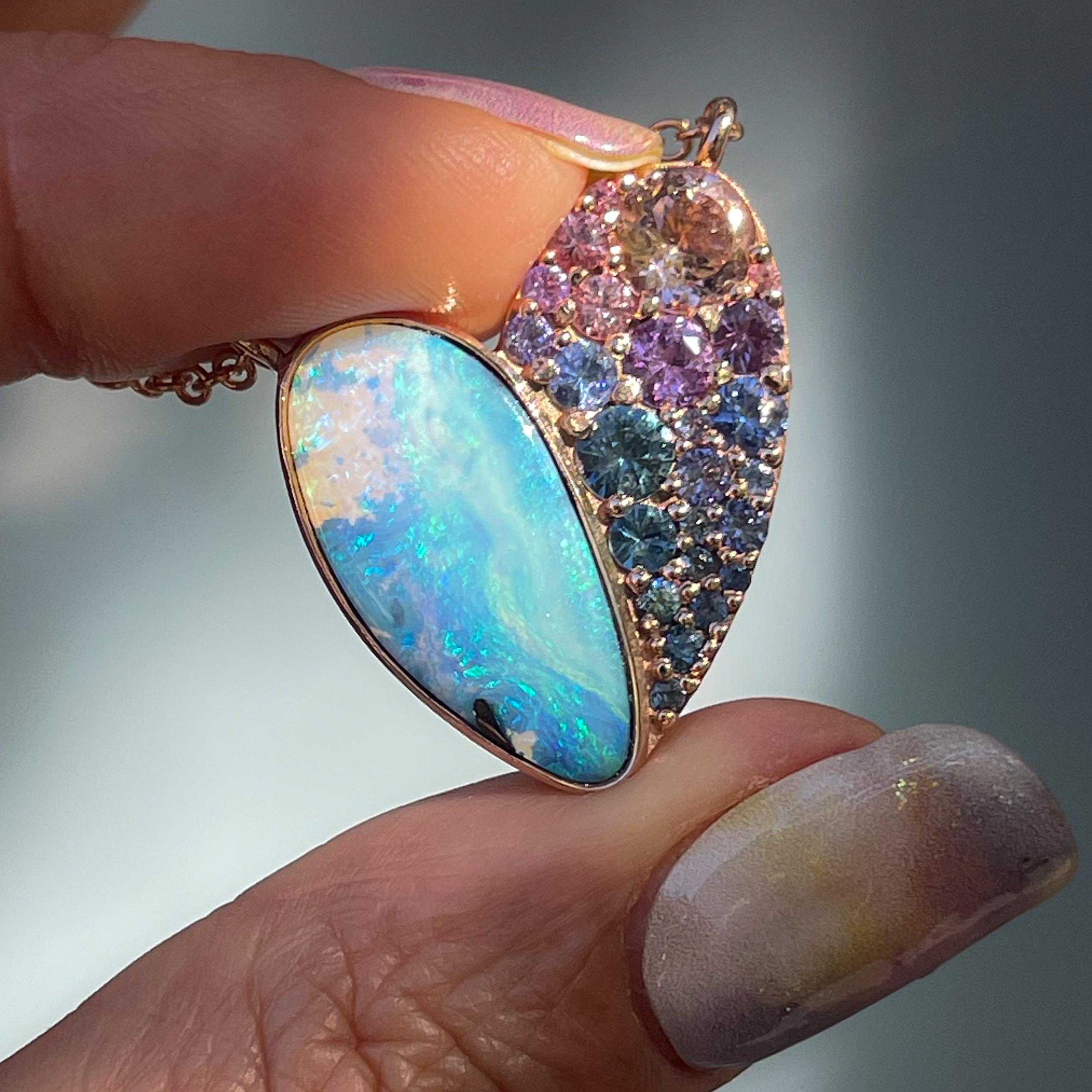 A chromatic mosaic delights the soul in this Heart Opal Necklace. Half Boulder Opal, half faceted gems, the choreographed heart necklace pulses with life. Inherent to the opal are a range of hues; from teal, cerulean, and periwinkle to lavender and