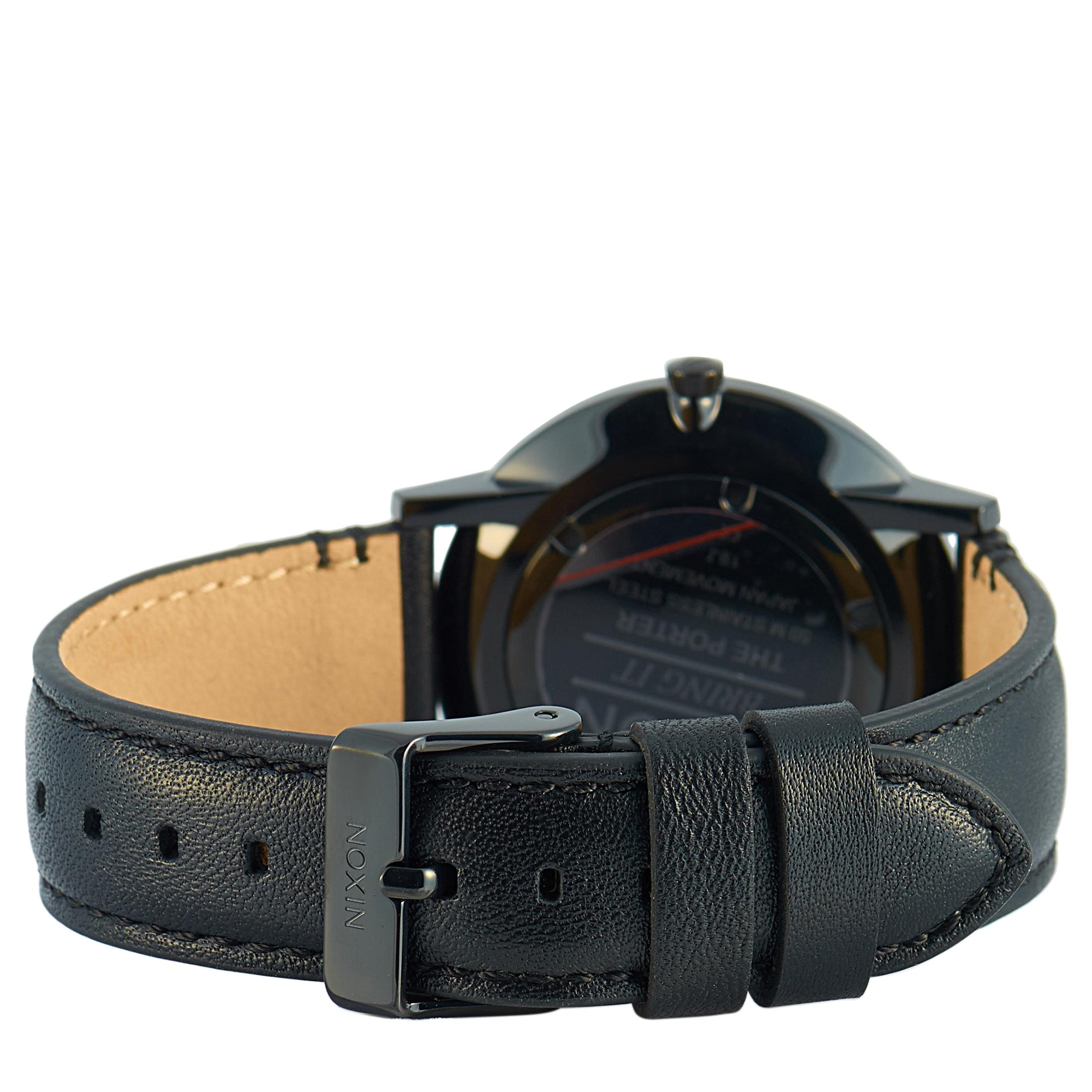 The Nixon Porter Leather All Black watch, reference number A1058-1031-00, comes with a 40 mm black-tone stainless steel case that is presented on a black leather strap, secured on the wrist with a tang buckle. The case is water-resistant to 50