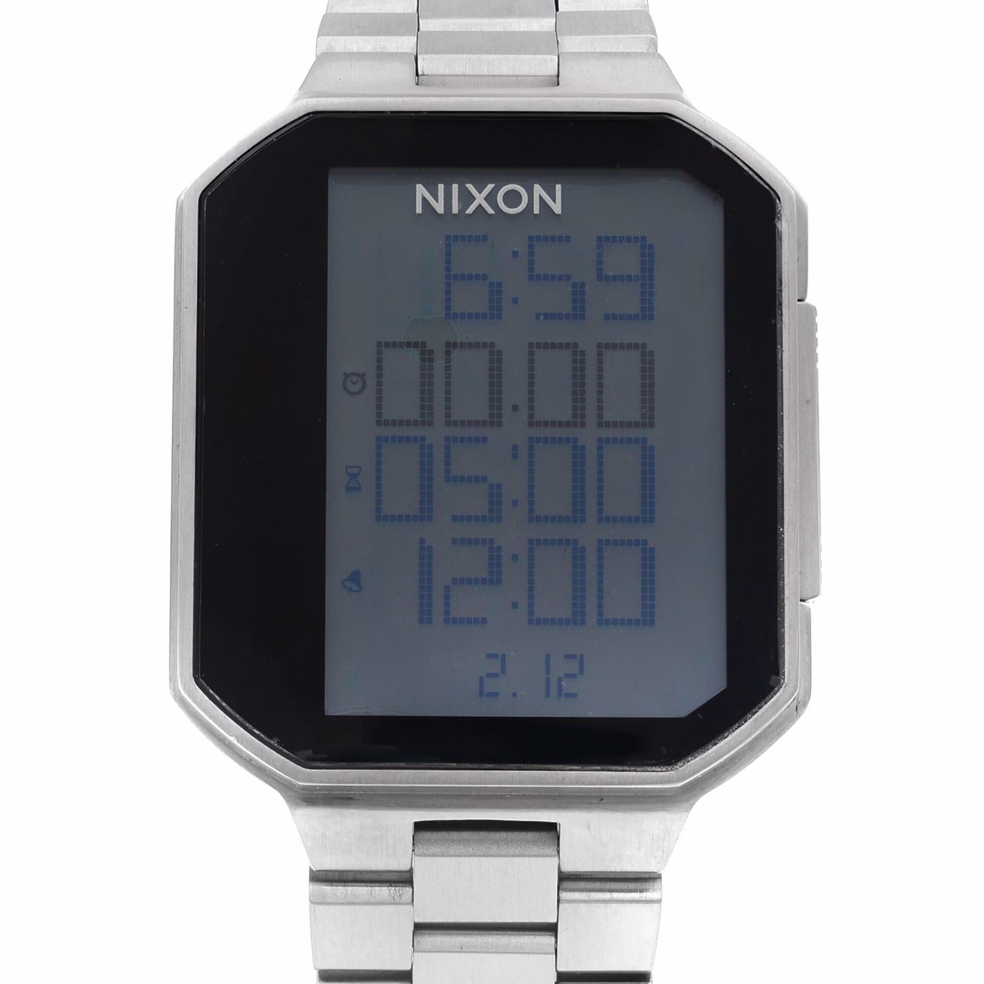 This Display Model Nixon  A323-000 is a beautiful men's timepiece that is powered by quartz (battery) movement which is cased in a stainless steel case. It has a  rectangle shape face,  dial and has hand unspecified style markers. It is completed