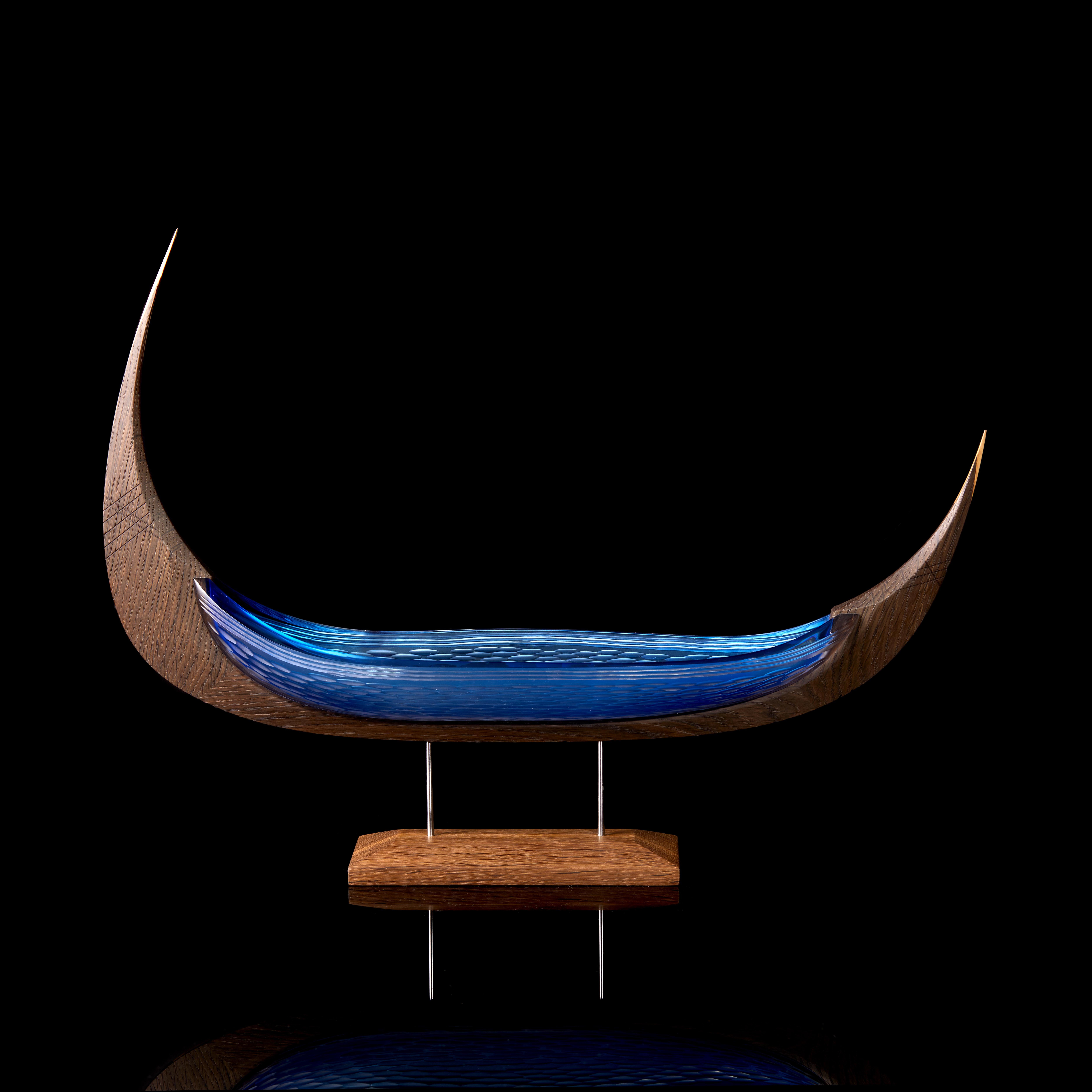 'Njal' from the Glasskibe Collection is a unique glass and oak sculpture by the Danish and British artists, Backhaus & Brown and Egeværk.

The title explained by the artists;


