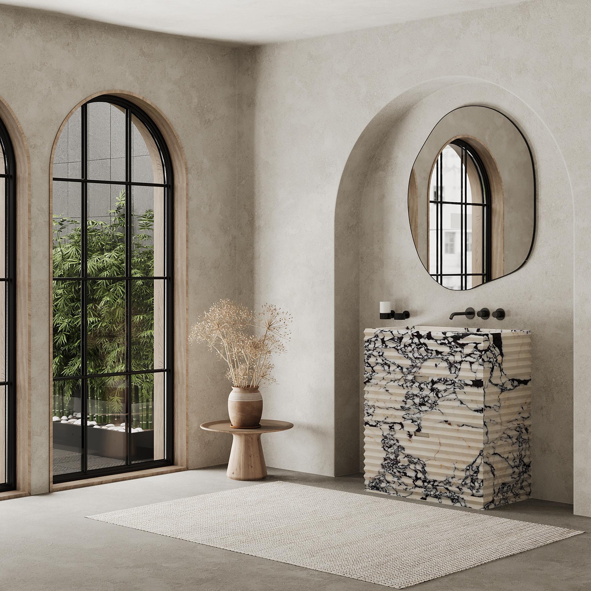 Enhance your bathroom with our luxurious Njord Marble Vanity, featuring a beautifully ribbed texture that adds depth and character to your bathroom aesthetics. The exterior is crafted entirely from premium marble, with the interior crafted in a