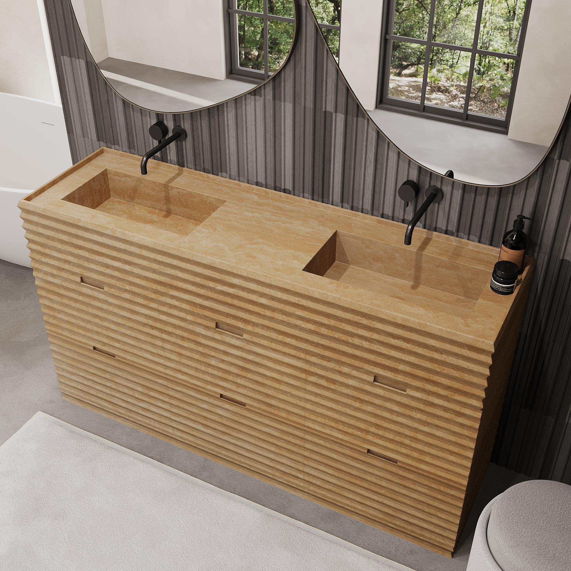Verschönern Sie Ihr Badezimmer mit unserem luxuriösen Njord Marmorwaschtisch mit zwei Becken, der mit seiner schön gerippten Struktur Ihrem Badezimmer Tiefe und Charakter verleiht. Das Äußere ist komplett aus hochwertigem Marmor gefertigt, während