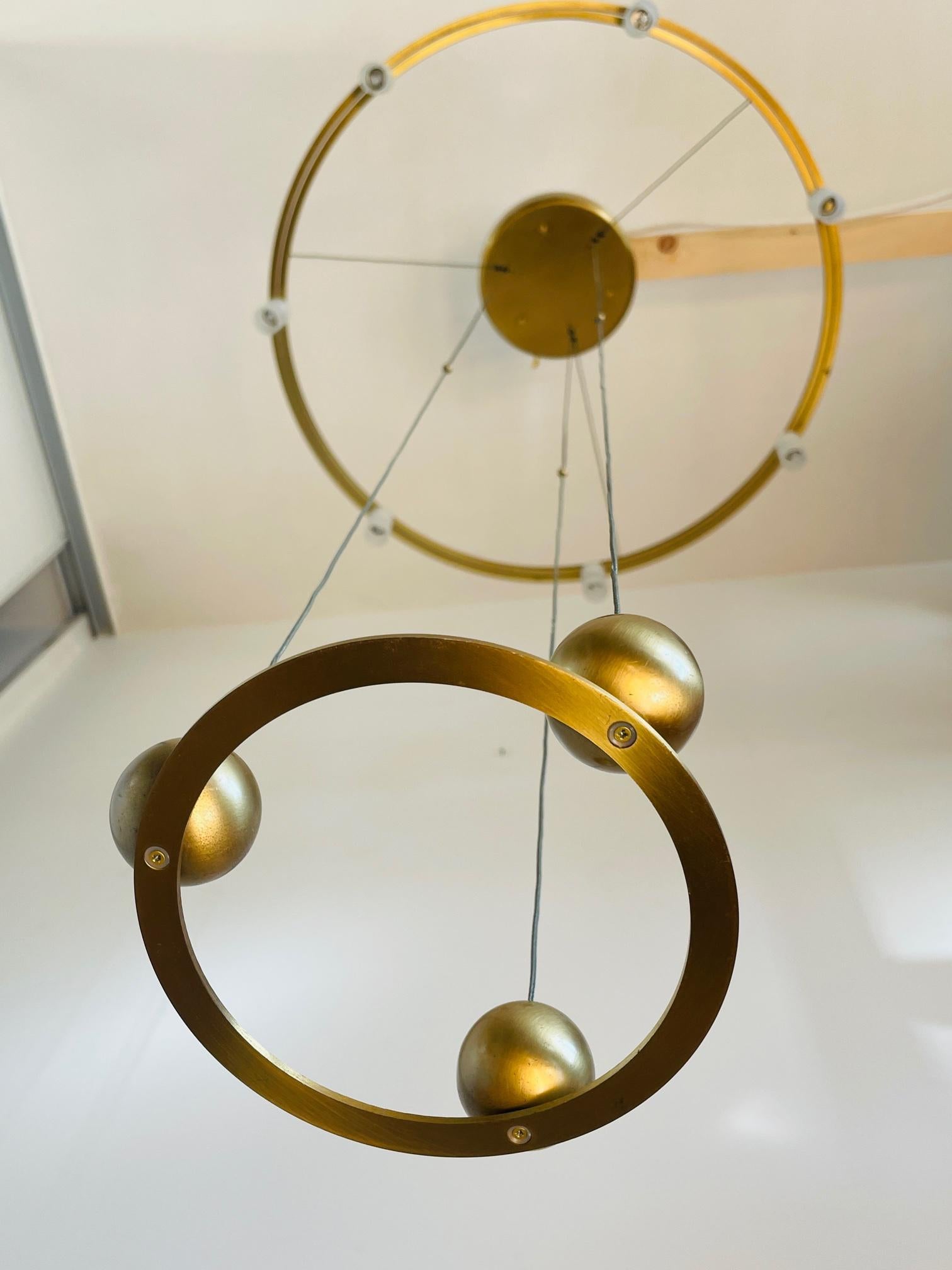 Beautiful adjustable pendant made by the German company N Licht. 
The lamp was made in early 2000. It is a beautiful piece of design. As you can see on the pictures the lamp is really slim and perfectly balanced. As well the design as how it easely